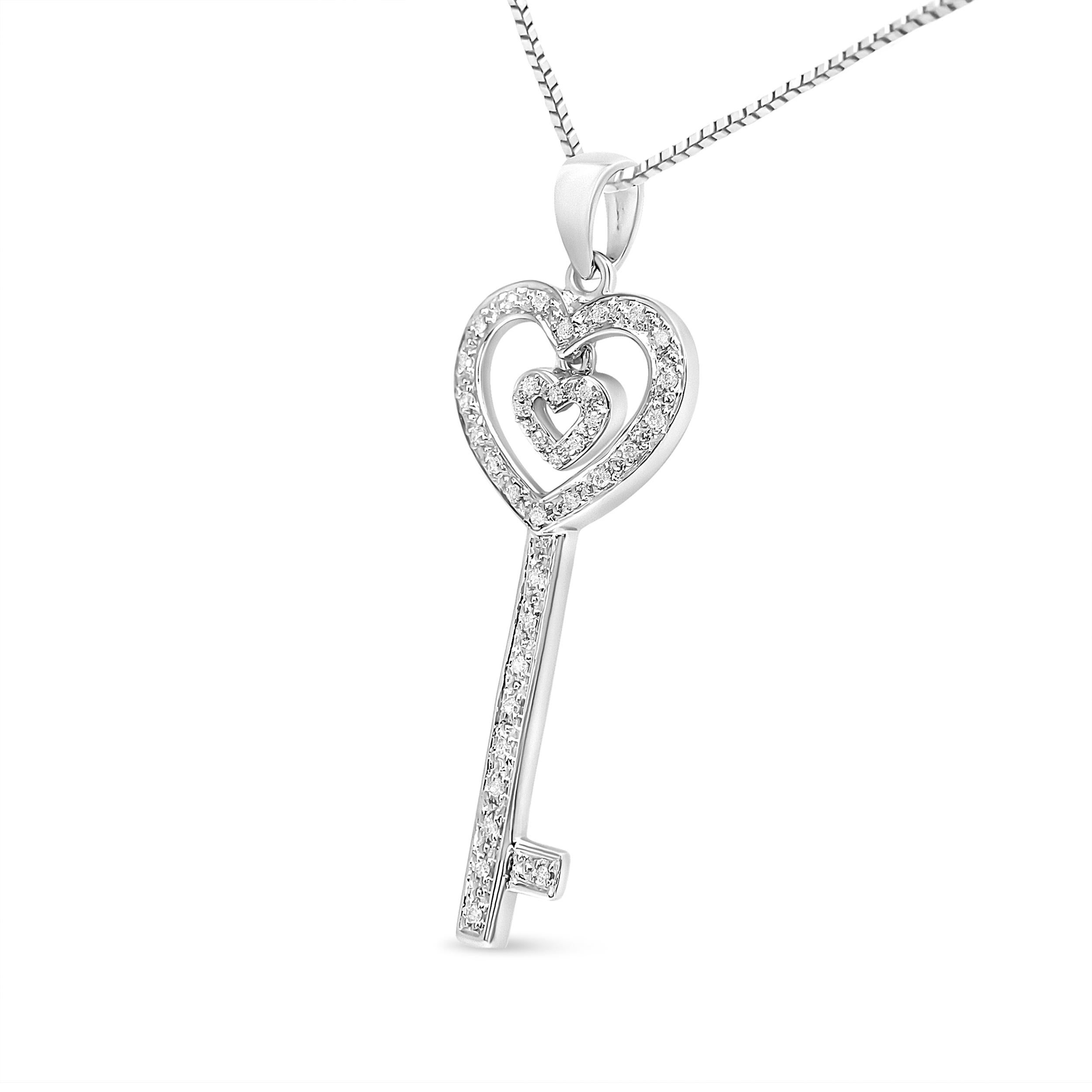 Wear love on your neck by adorning this beautiful diamond double heart & key pendant! This necklace is crafted in genuine .925 sterling silver and is embellished with a total diamond carat weight of 1/5 c.t. The double heart and key motif is set