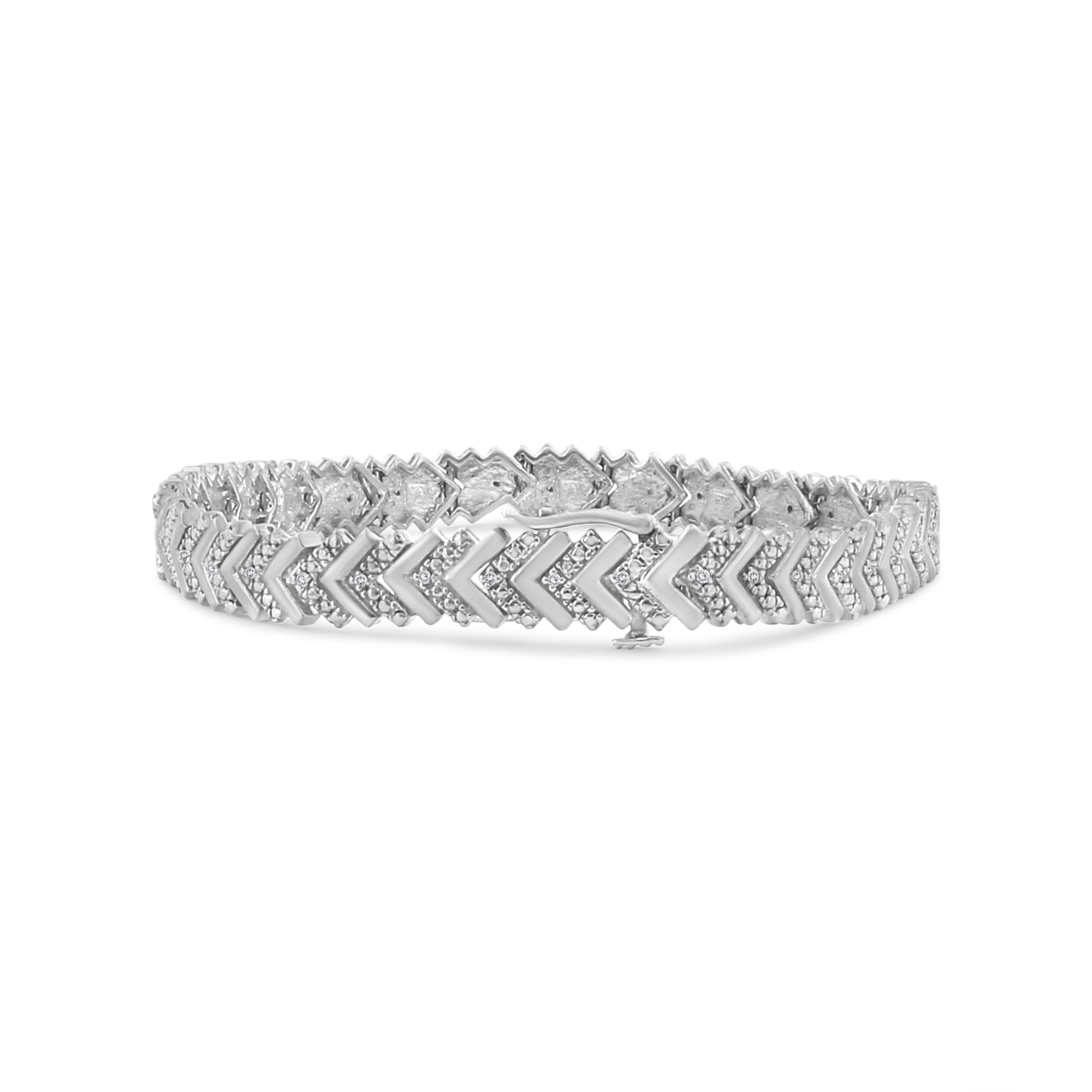 Beautiful and eye-catching, this stunning link bracelet has a total diamond weight of 1/6 c.t. This piece is crafted in genuine .925 sterling silver, a metal that will stay tarnish free for years to come. The design of this bracelet is an