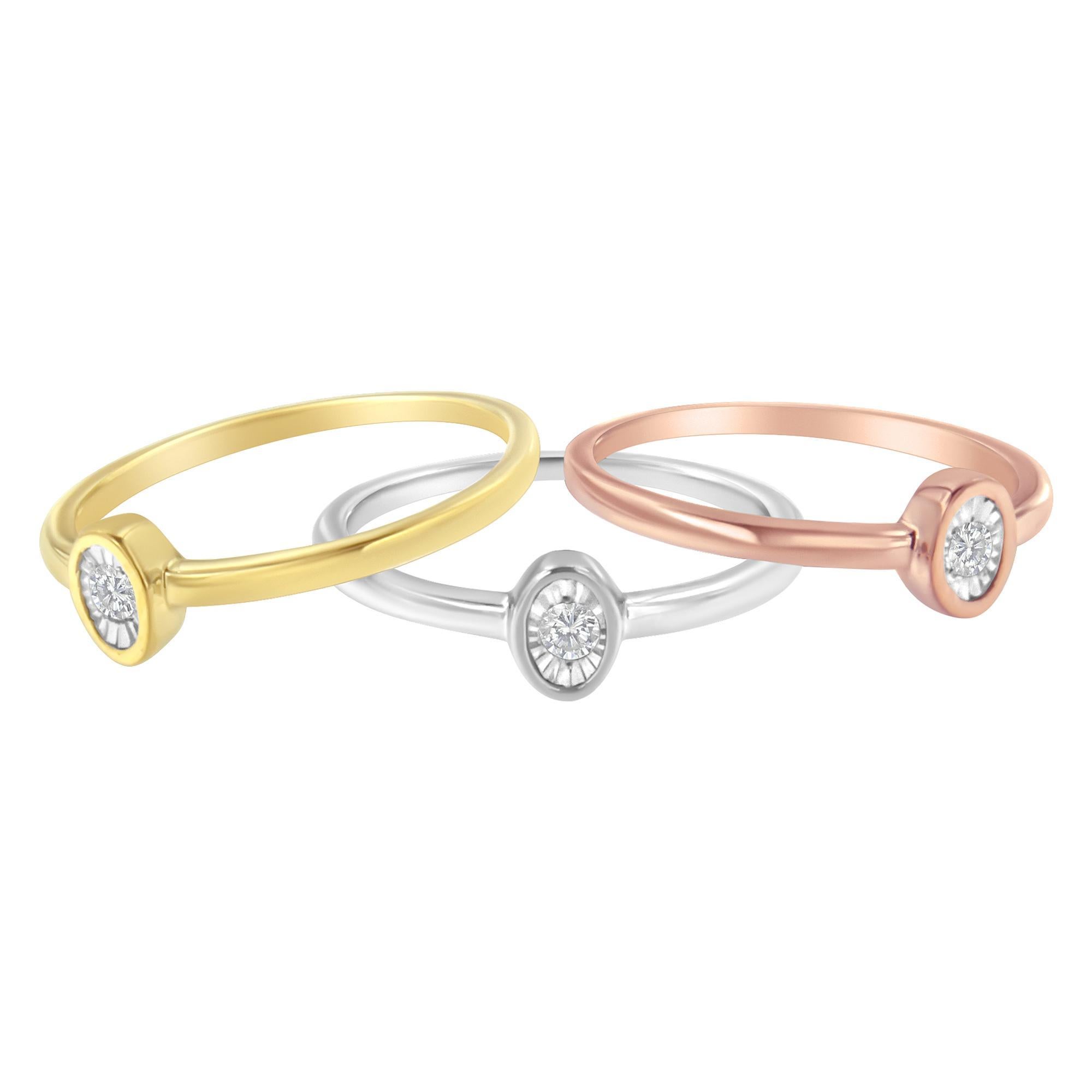 Exquisite and classic yellow, white, and rose sterling silver stackable ring set with 0.12 ct diamonds. Each ring features a round cut diamond in a miracle setting inside an ovular shape. Wear them together or by themselves, you can never go wrong