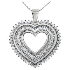 A Silver 1.0 Carat Baguette and Round Diamond Heart Pendant Necklace
