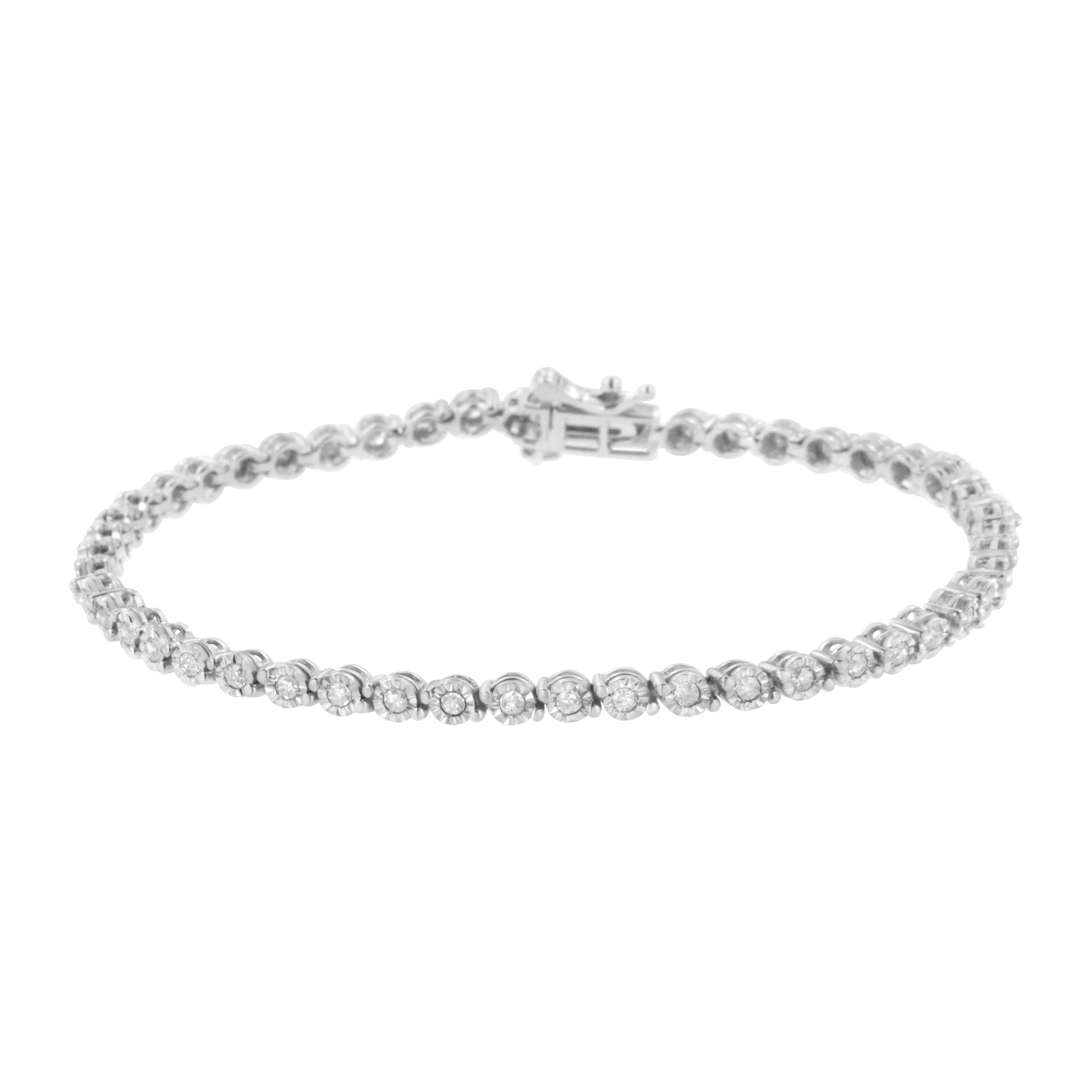 This classic link bracelet will become a staple in your jewelry collection. Created in glimmering .925 sterling silver, this piece has bezel-set links embellished with beautiful, natural round-cut diamonds. Boasting an impressive total diamond