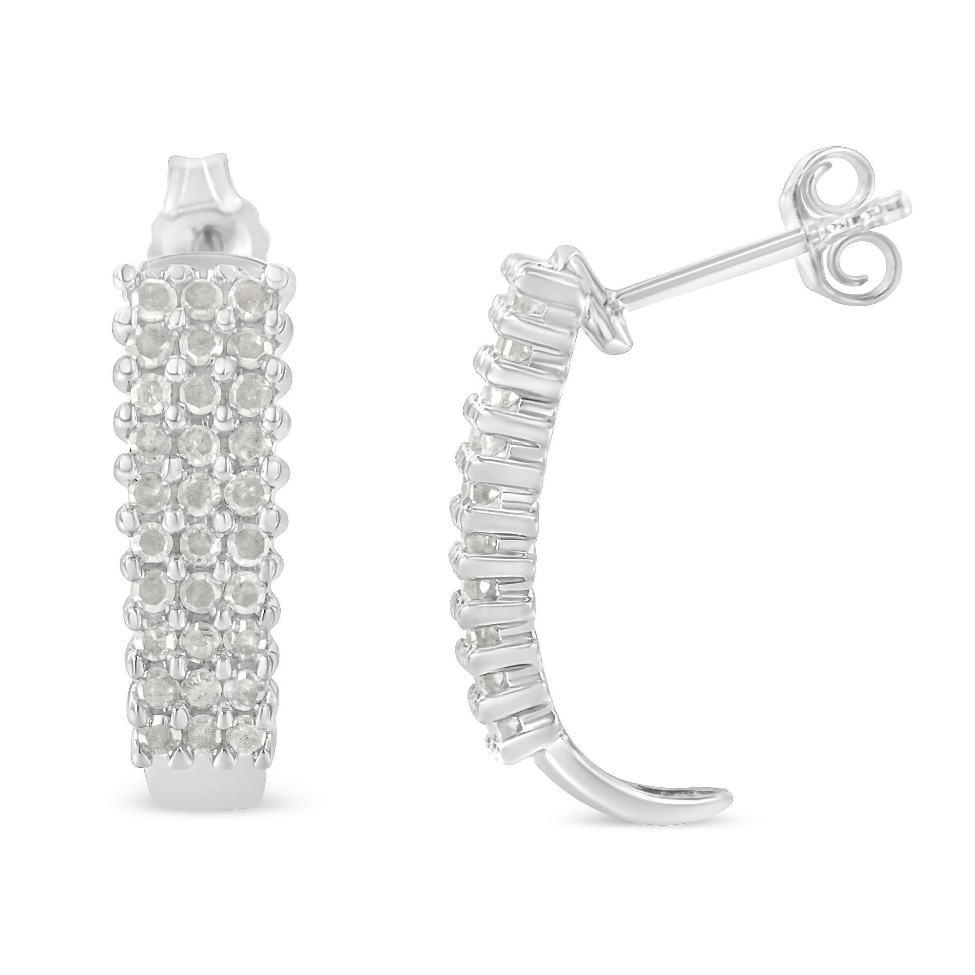 Accent your ears with these sterling silver J-hoop earrings. Representing an extreme luminosity, the hoop earrings are adorned with shimmering rose cut diamonds. The heavily encrusted diamonds in a prong setting adds extraordinary brilliance to this