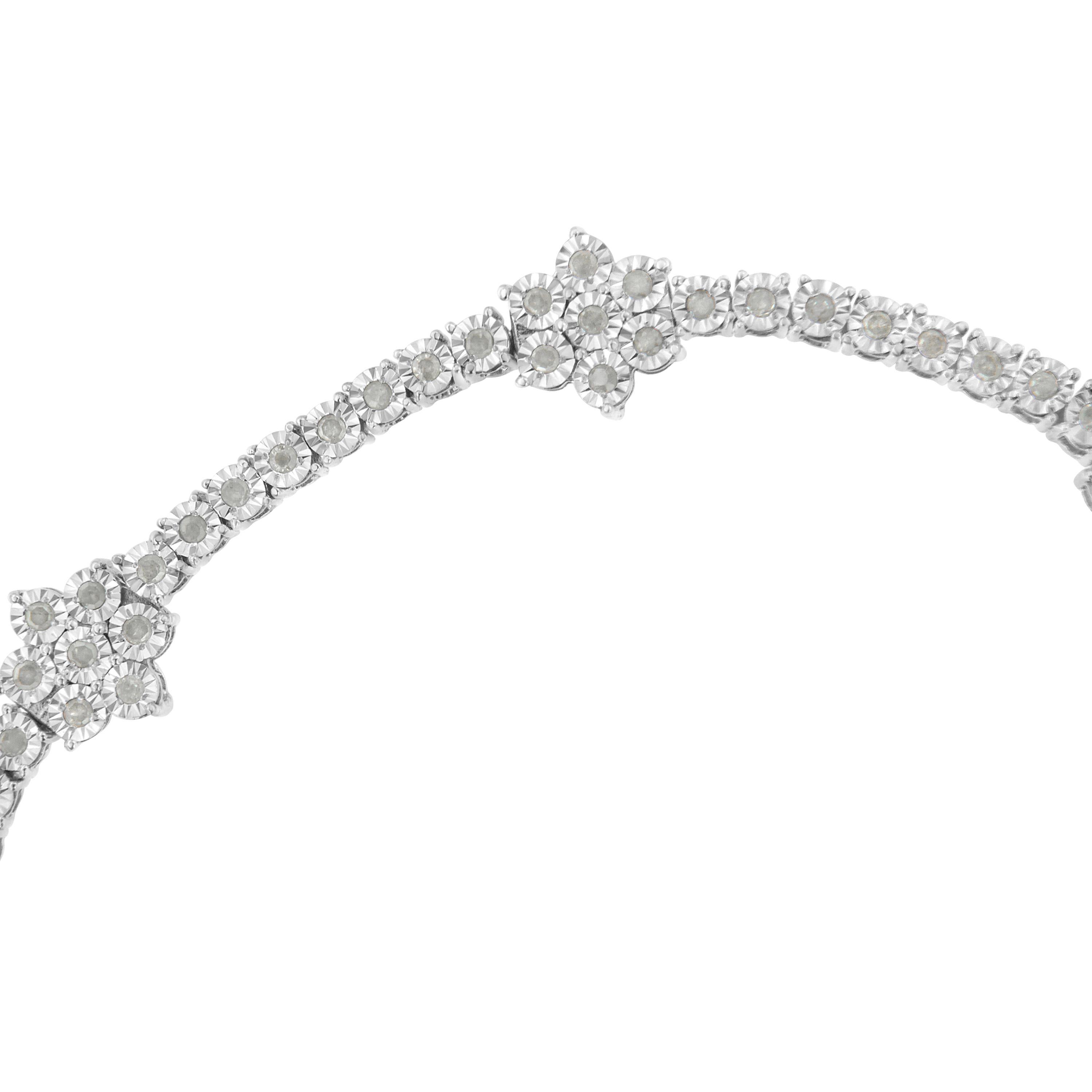 Elegant and timeless, this gorgeous sterling silver floral link bracelet features 1.0 carat total weight of round cut diamonds. The tennis bracelet features round, flower shaped cluster links along with individual four prong basket links. The