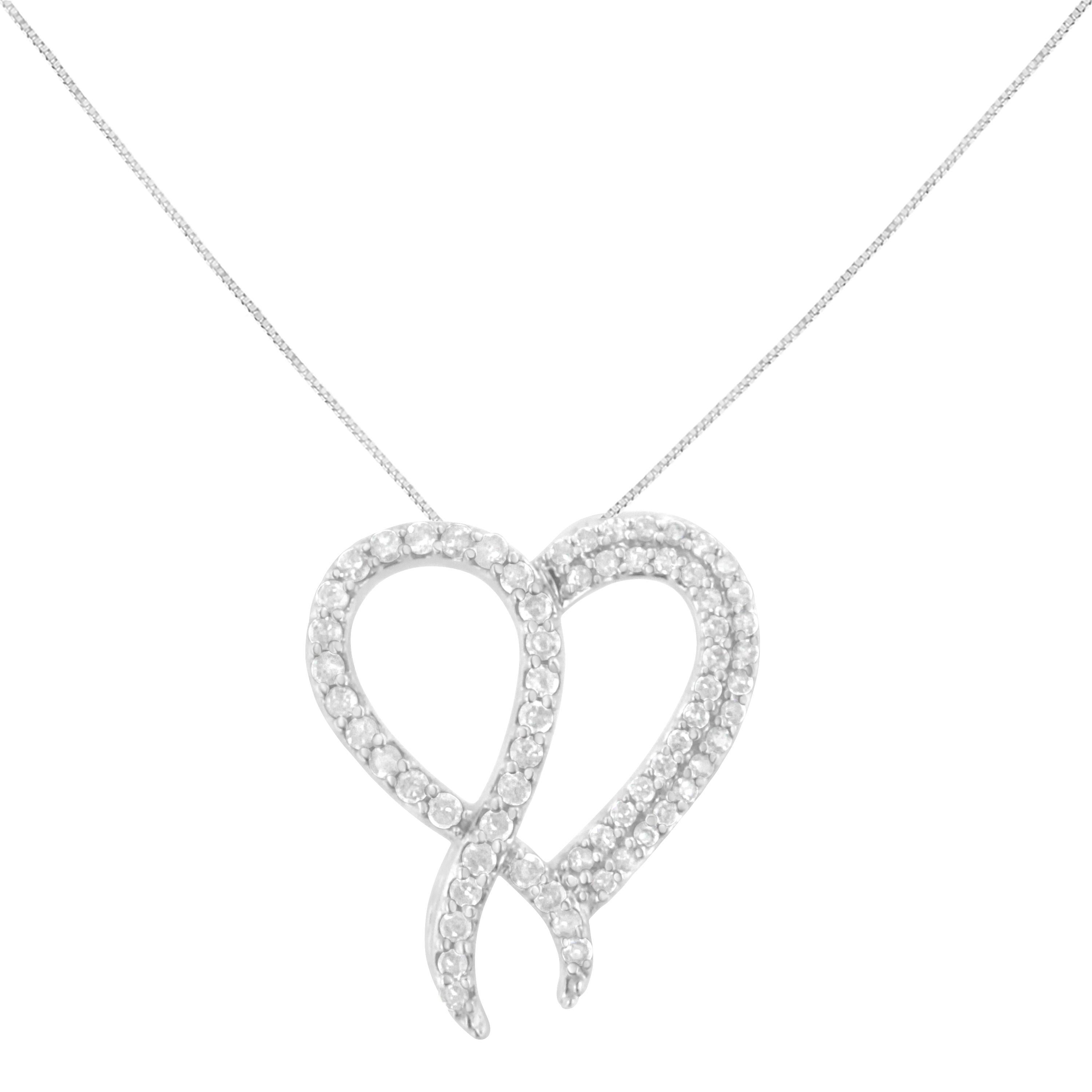 This elegant .925 sterling silver pendant has a gorgeous heart motif with a ribbon overlapping to one side. The necklace is studded with 1 ct tdw of beautiful, round-cut diamonds in a prong setting. This piece comes with a sterling silver 18