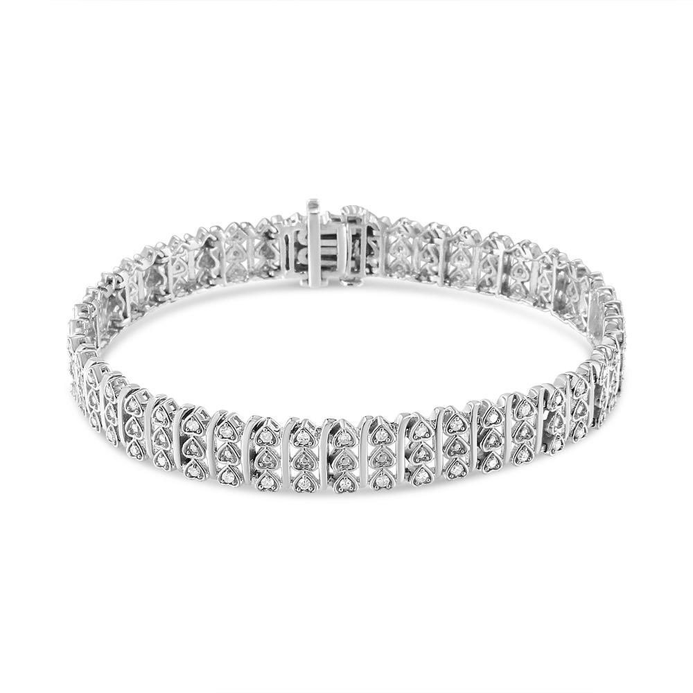 This lovely sterling silver link bracelet will make you stand out with its sparkle and love. Three vertical rows of of heart links form this bracelet. Each heart holds a single diamond for a total of 90 sparkling, natural diamonds.. This 1 ct. t.w.