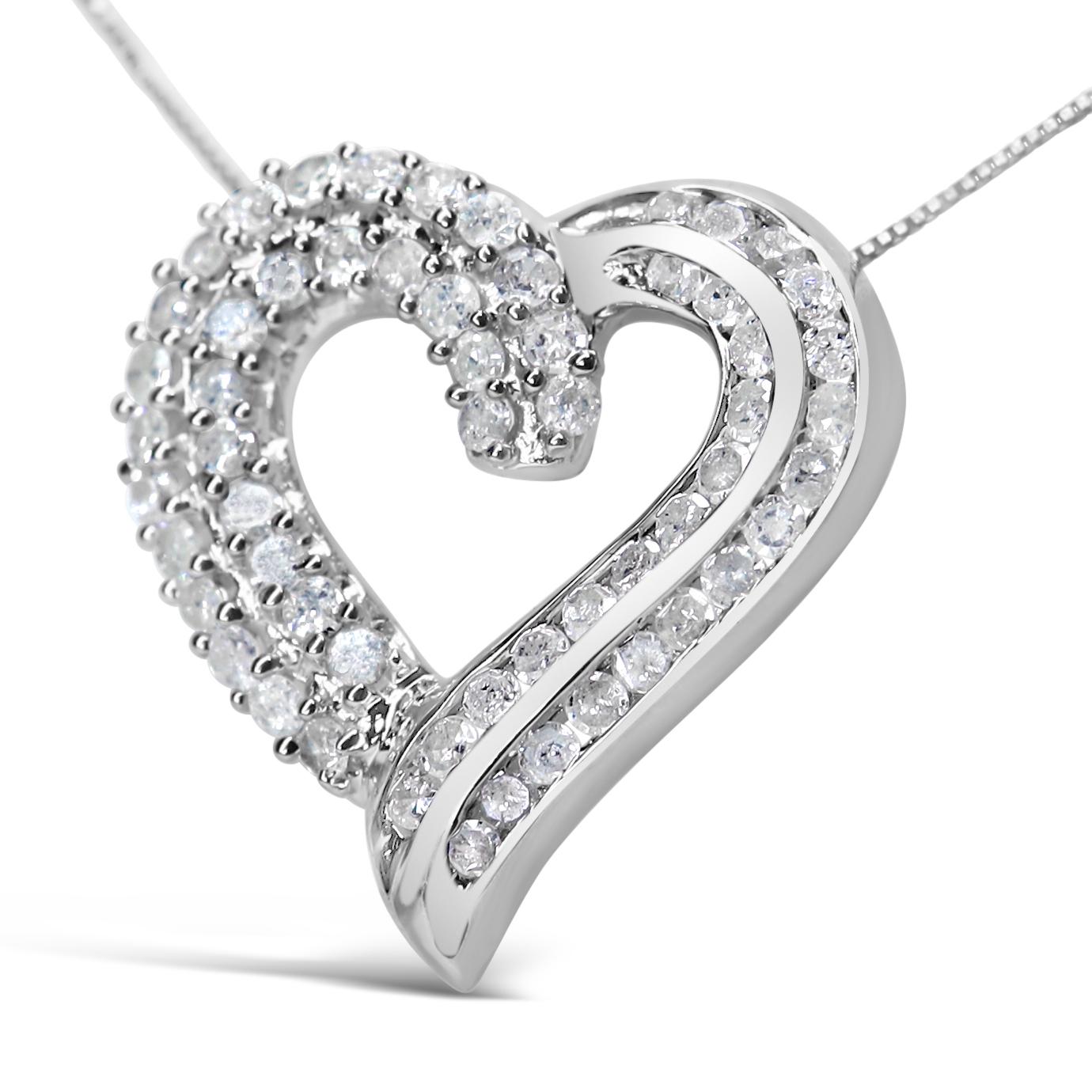 Ce collier à pendentif sensationnel vous mettra dans un état d'esprit romantique, car sa silhouette de cœur ajouré scintille de diamants ronds ! Le design saisissant rayonne de beauté grâce aux rubans sculptés de diamants sertis en canal sur deux