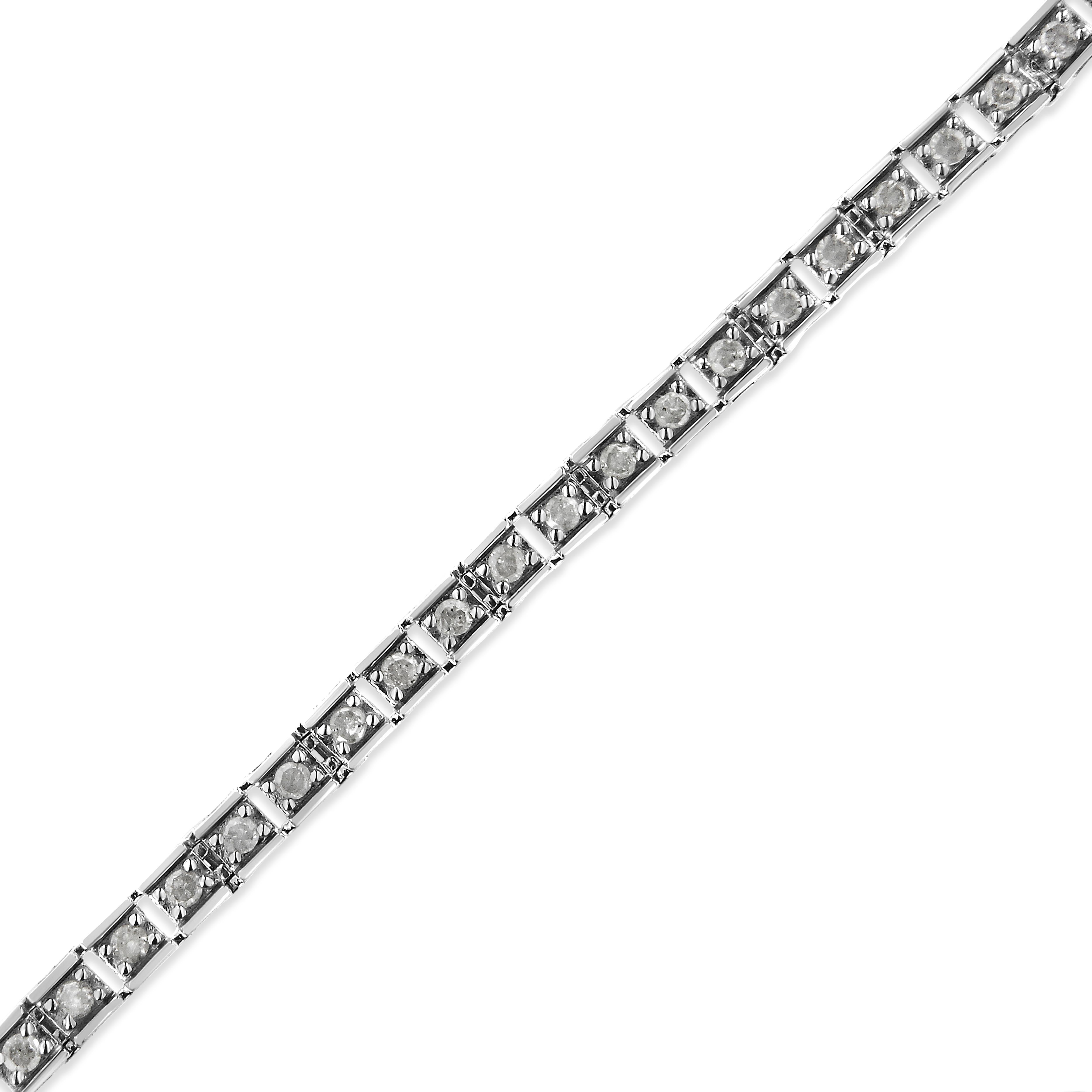 Elegant and timeless, this sterling silver tennis bracelet features 1.0 carat total weight of round, brilliant cut diamonds with a whopping 50 stones in all. The tennis bracelet has multiple hinged links consisting of three prong set diamonds each