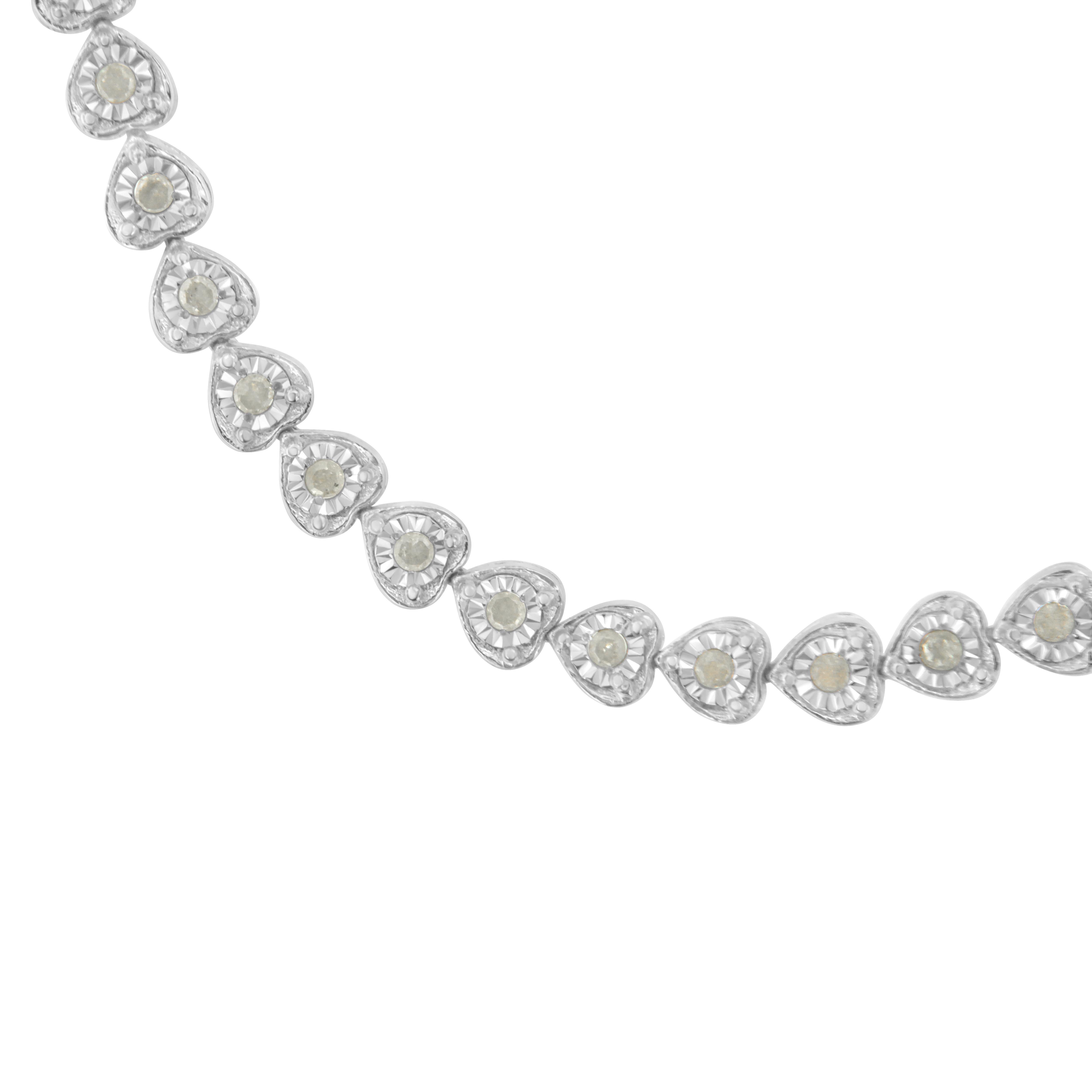 Create your signature look by wearing this elegant diamond tennis link bracelet. Featuring a seamless row of heart accents, adorned with rose-cut diamonds and set in a sterling silver framing this bracelet has a classy appearance. This modern