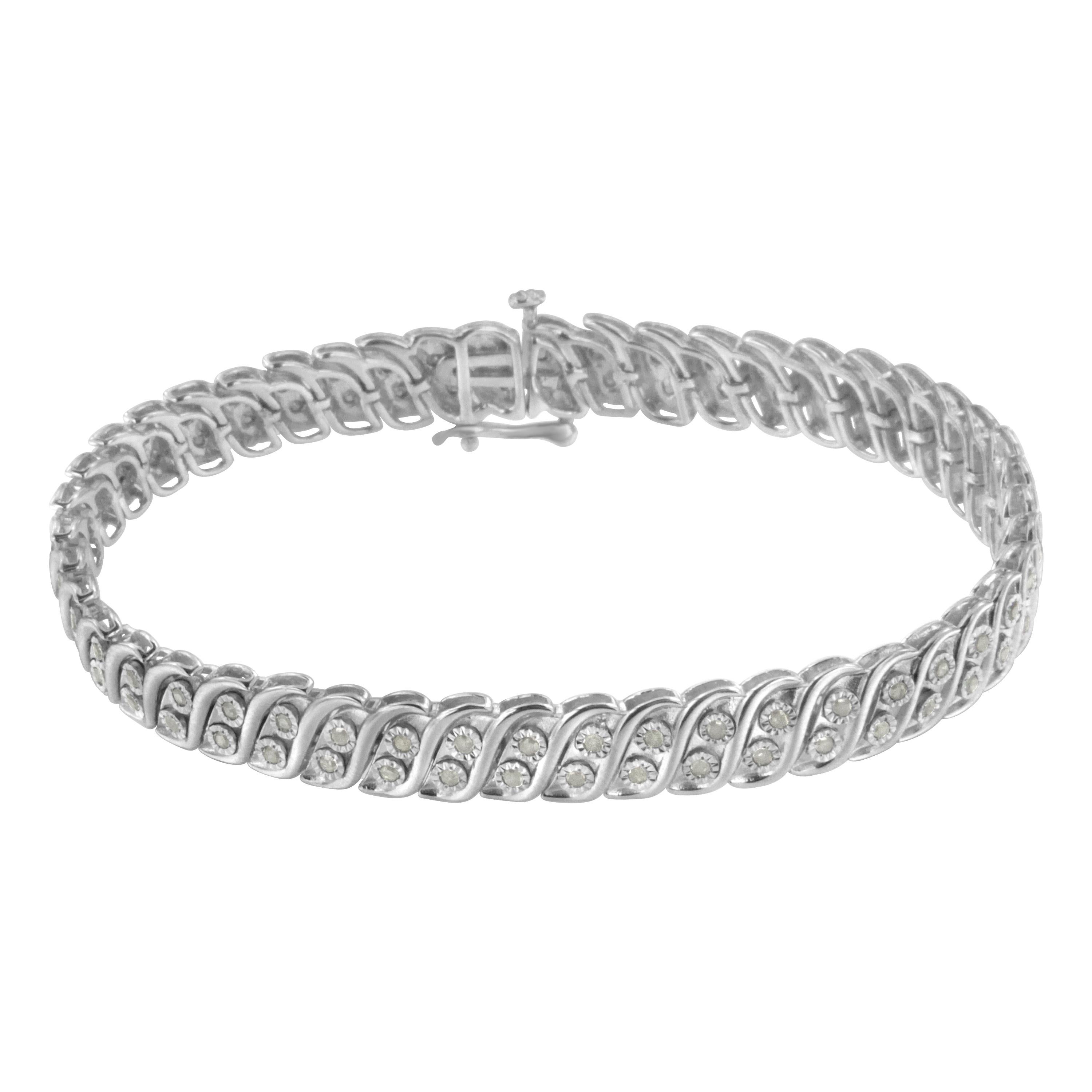 Elegant and timeless, this gorgeous sterling silver tennis bracelet features 1.0 carat total weight of round, rose cut diamonds. The tennis bracelet features S curved links with a duo of petite genuine round near colorless I-J color diamonds