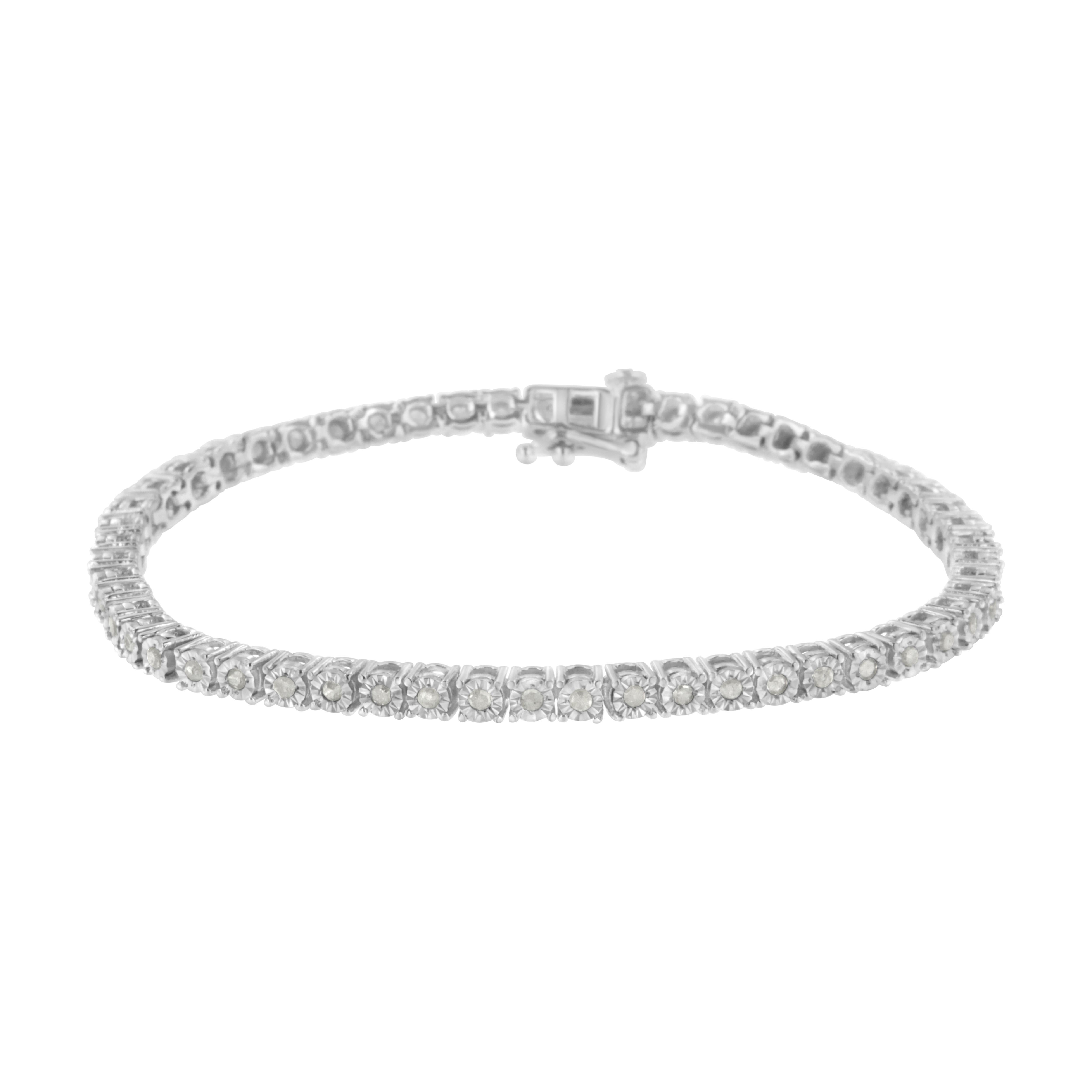 This gorgeous .925 sterling silver tennis bracelet features 1.0 carat total weight with 52 round, rose cut diamonds. The tennis bracelet has hinged links with two shapes surrounding two diamonds on each side. Rose-cut, promo quality diamonds are