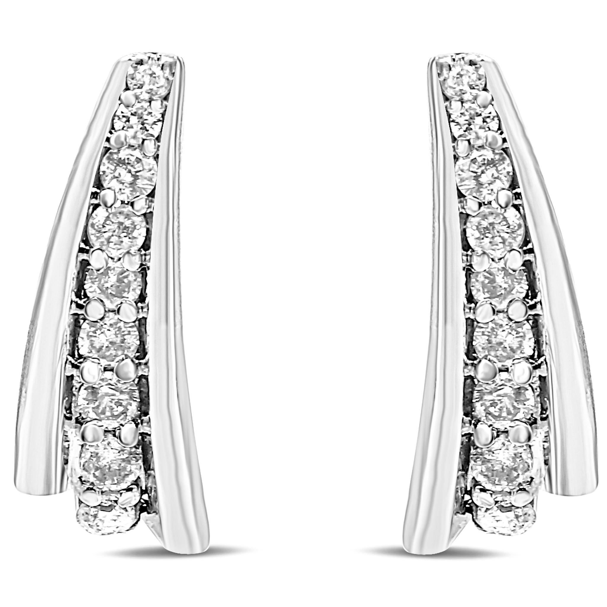 Embellished with natural diamonds, these striking 1.00 c.t. earrings are not your average huggy hoops. Take a closer look and you’ll notice that they feature an asymmetrical silhouette that radiates a modern allure, and it’s perfect for ladies who’d