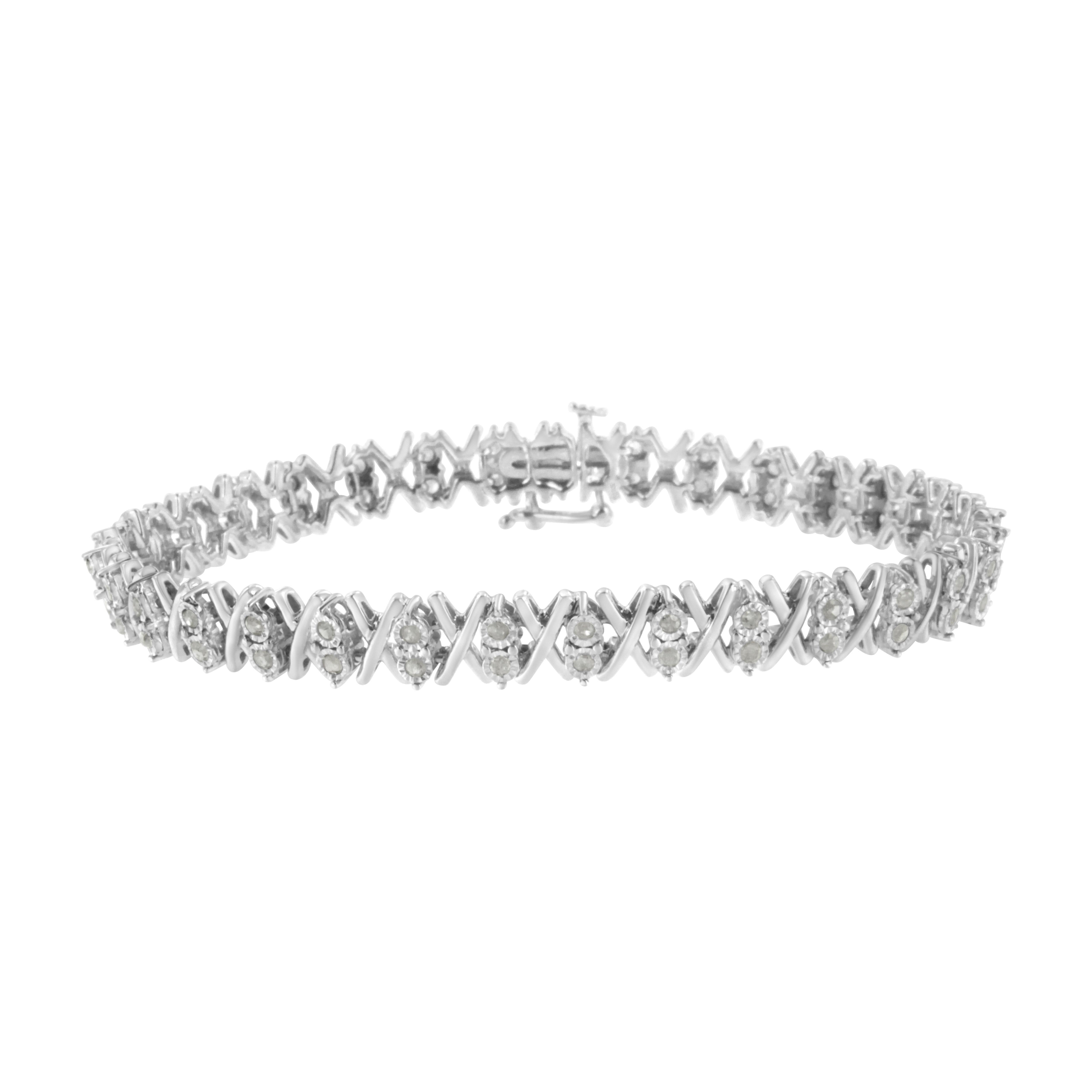 Embellish your wrist with this stunning and unique X tennis bracelet. Fashioned in polished sterling silver this design showcases 1ct TDW of glittering round cut diamonds. Carefully crafted X links alternate with miracle set diamonds throughout the