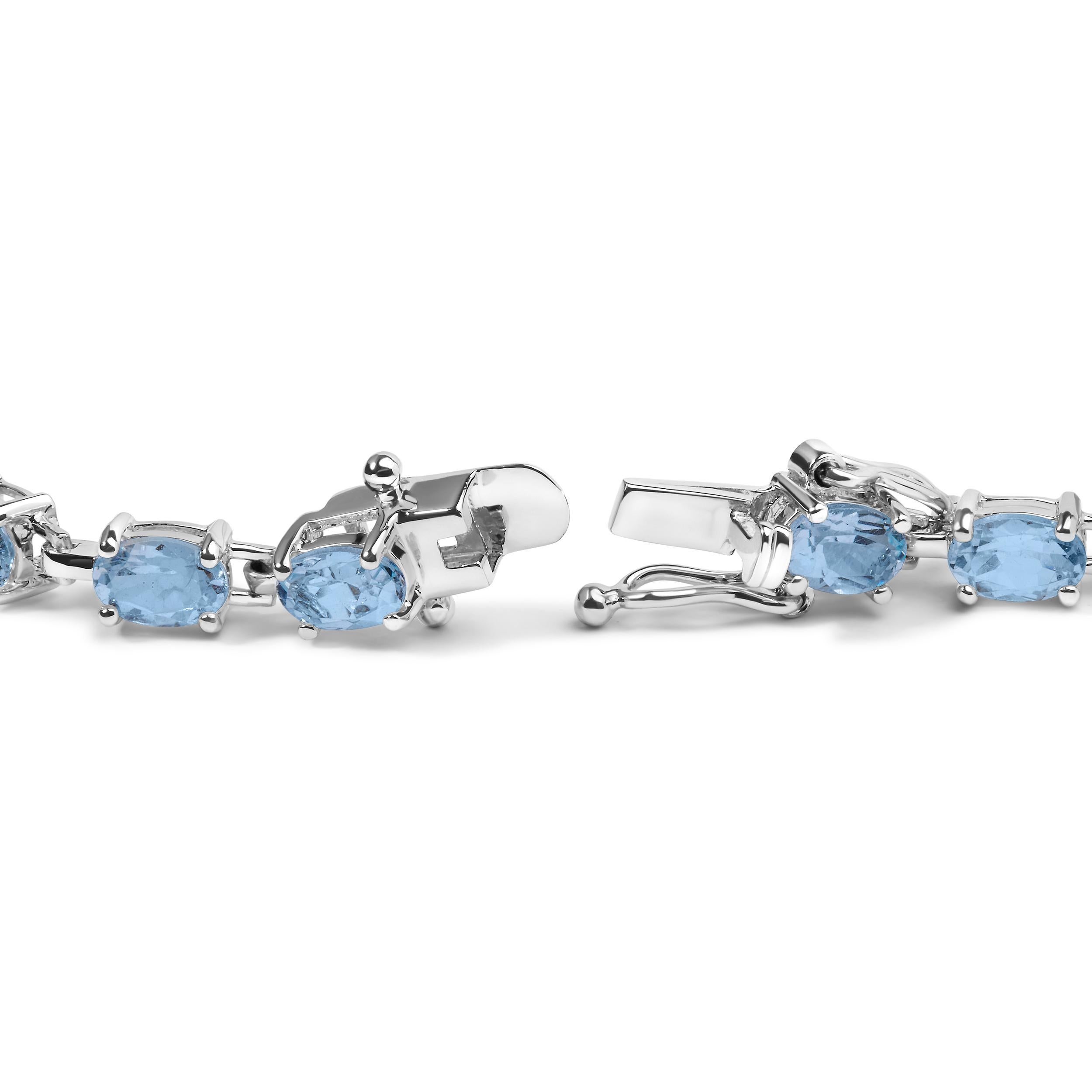 Indulge in the enchanting allure of this .925 Sterling Silver Link Bracelet. Adorned with 20 exquisite oval-shaped, lab-created Light Blue Topaz gemstones, totaling a remarkable 11 carats, this bracelet exudes elegance and sophistication. The