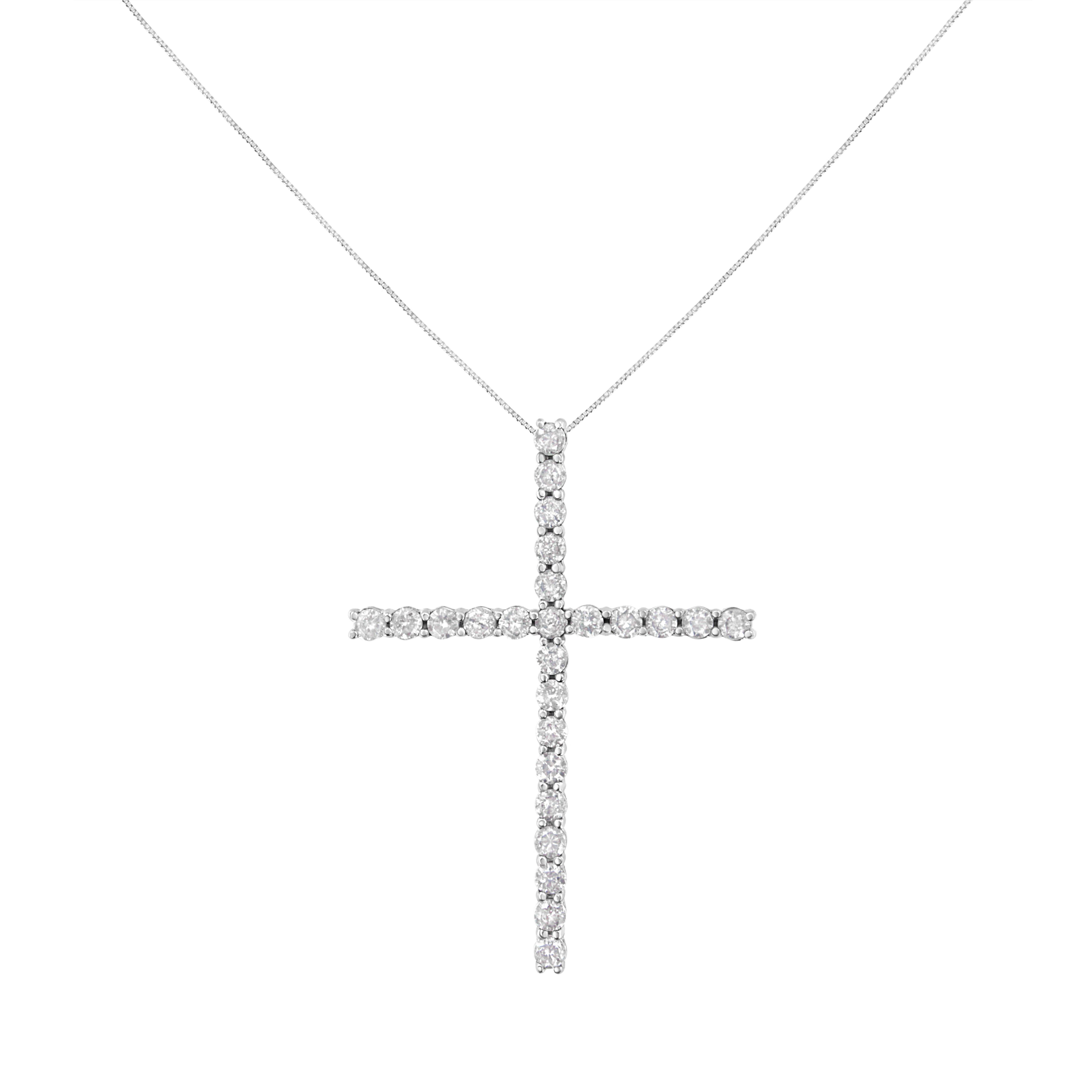 Share your faith with this stunning diamond cross pendant necklace. This cherished cross necklace for her, features 25 natural, round diamonds set in Sterling Silver. The pendant is suspended from an 18-inch box chain with spring ring. This fine