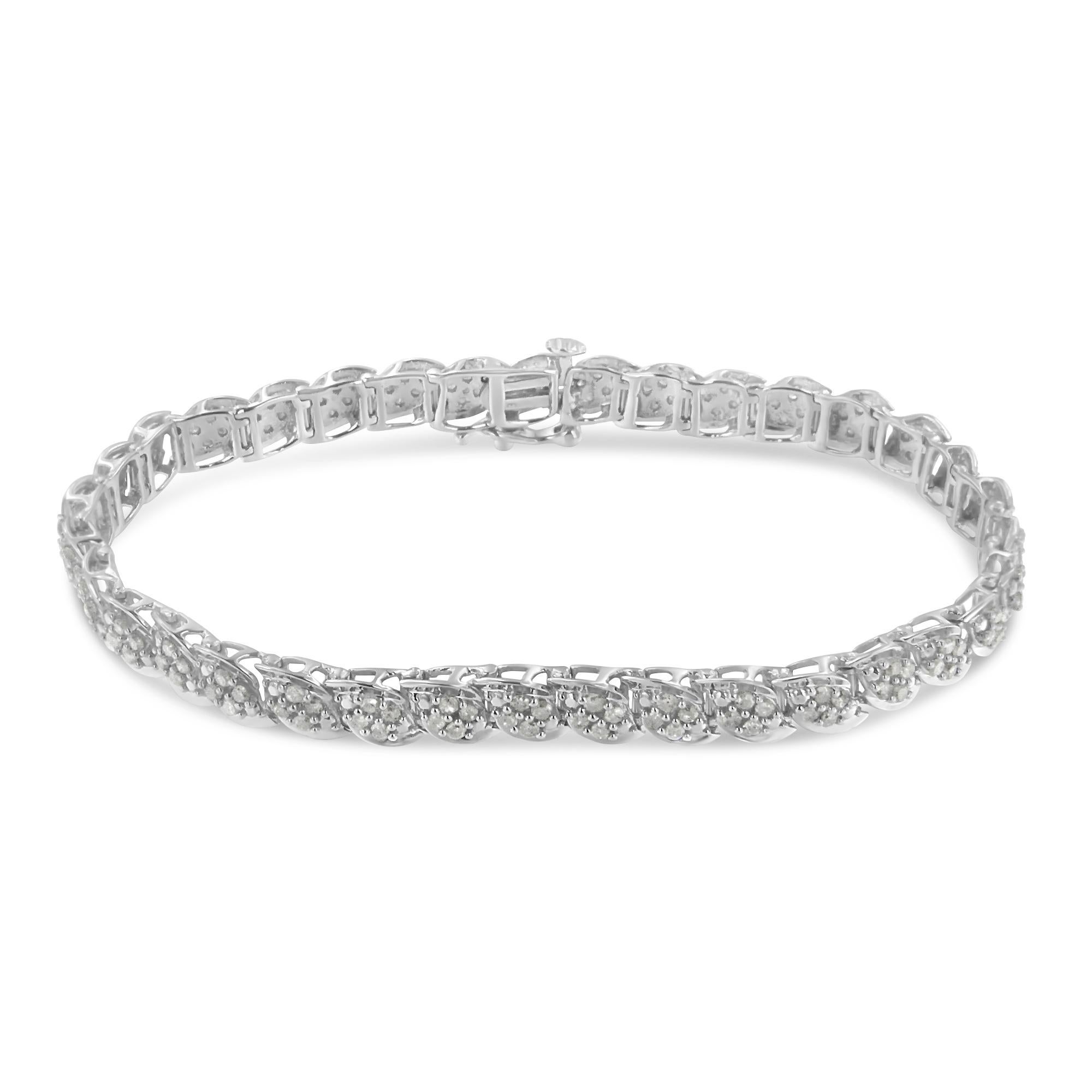 Add a touch of elegance to any outfit with this stunning white sterling silver bracelet. Embellished with diamonds in a prong setting to make up a total of 2 ct, this piece is meticulously crafted in a link design. This bracelet is made up of 140