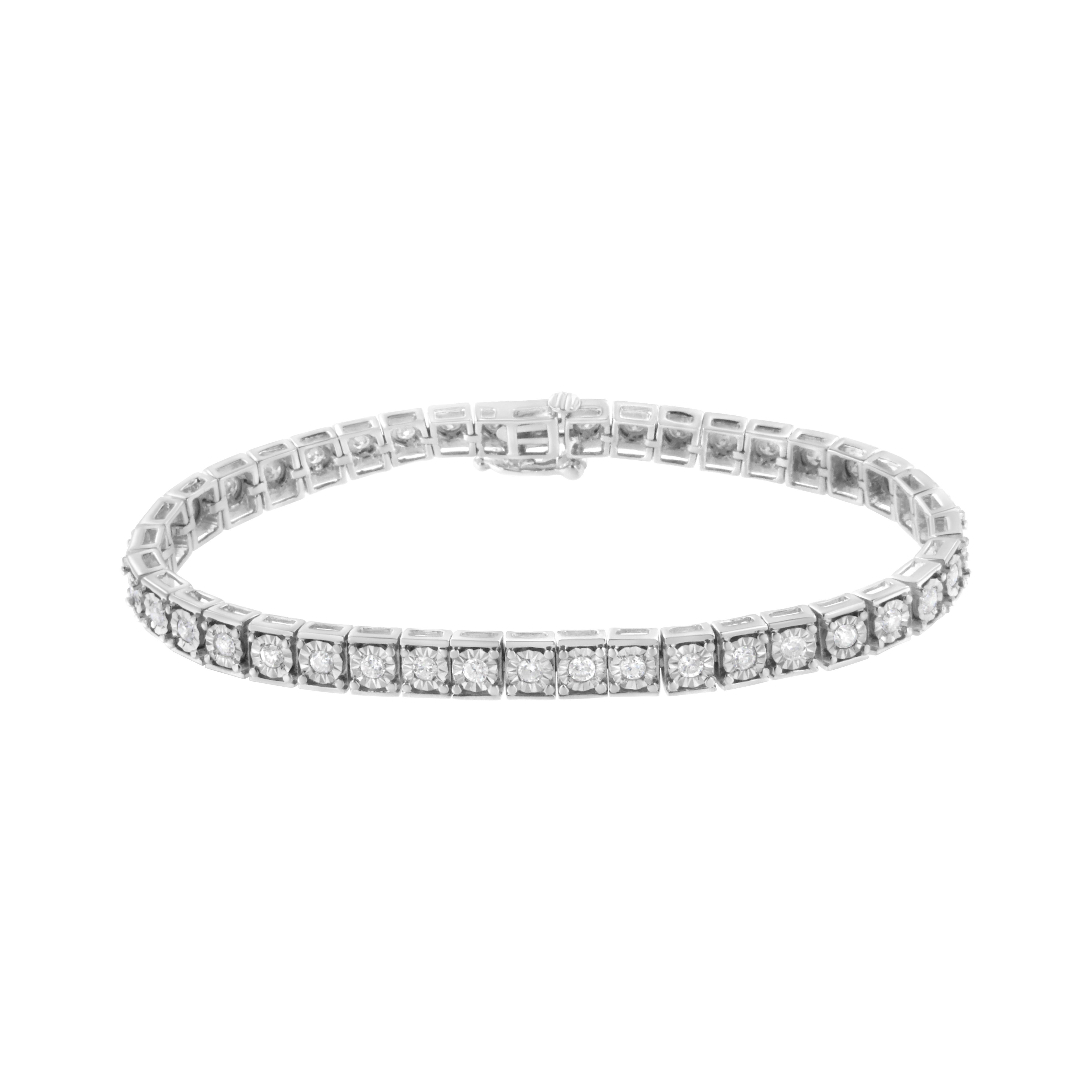 This elegant sterling silver tennis bracelet is created with 2 ct tdw of beautiful, natural diamonds. Rectangular links, each set with a round-cut diamond set in sterling silver, comprise the base of this design. This gorgeous piece will shine on