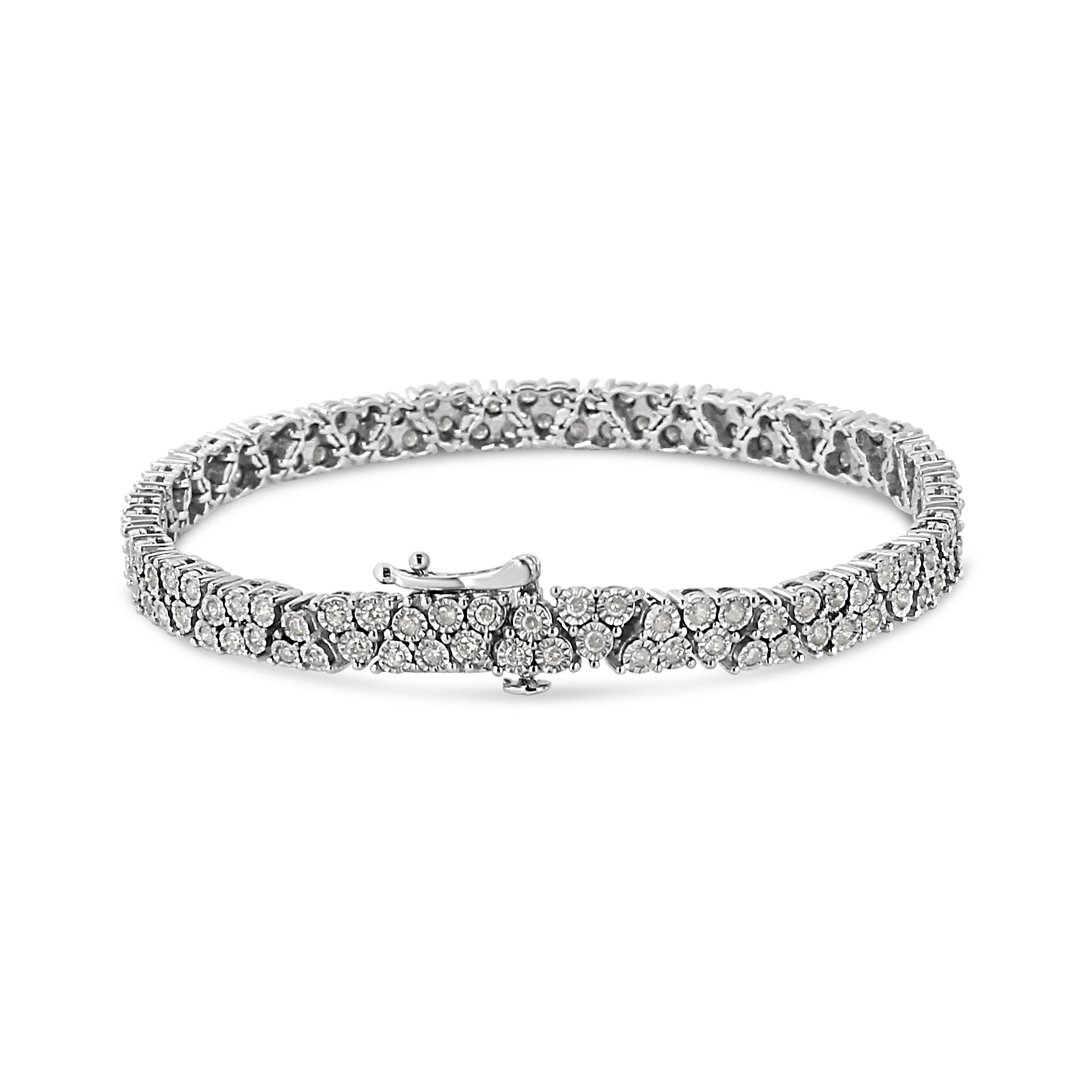 Triangular links embellished with natural, sparkling diamonds are set in gleaming silver to create this alluring tennis bracelet. This piece is crafted in the finest .925 sterling silver, and plated with rhodium (a platinum-family metal) for a