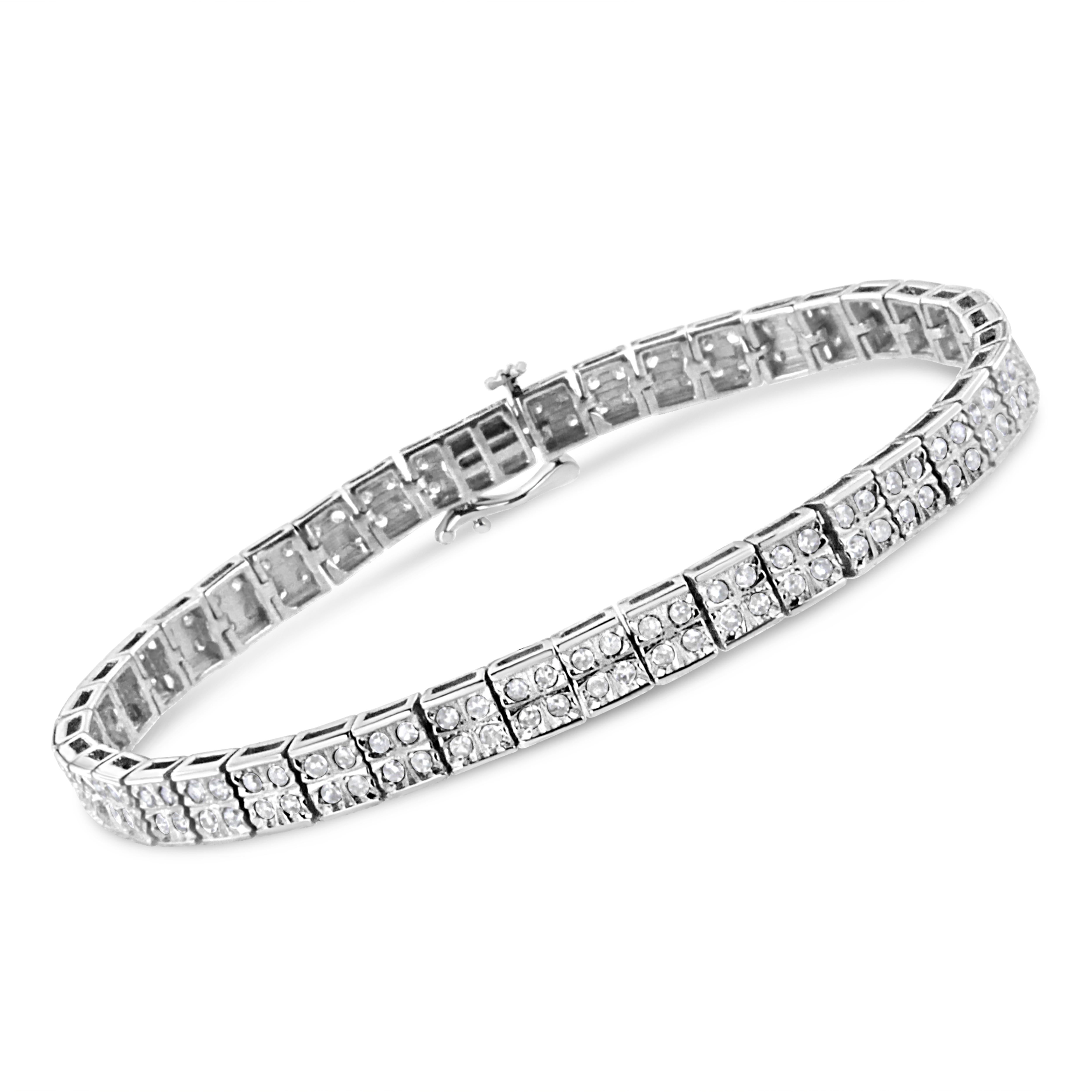 This beautiful link bracelet has a glamorous twist on a classic design. Square silver links are embellished with four stunning round-cut diamonds in an elegant prong setting. This authentic design is crafted of real 92.5% sterling silver that has