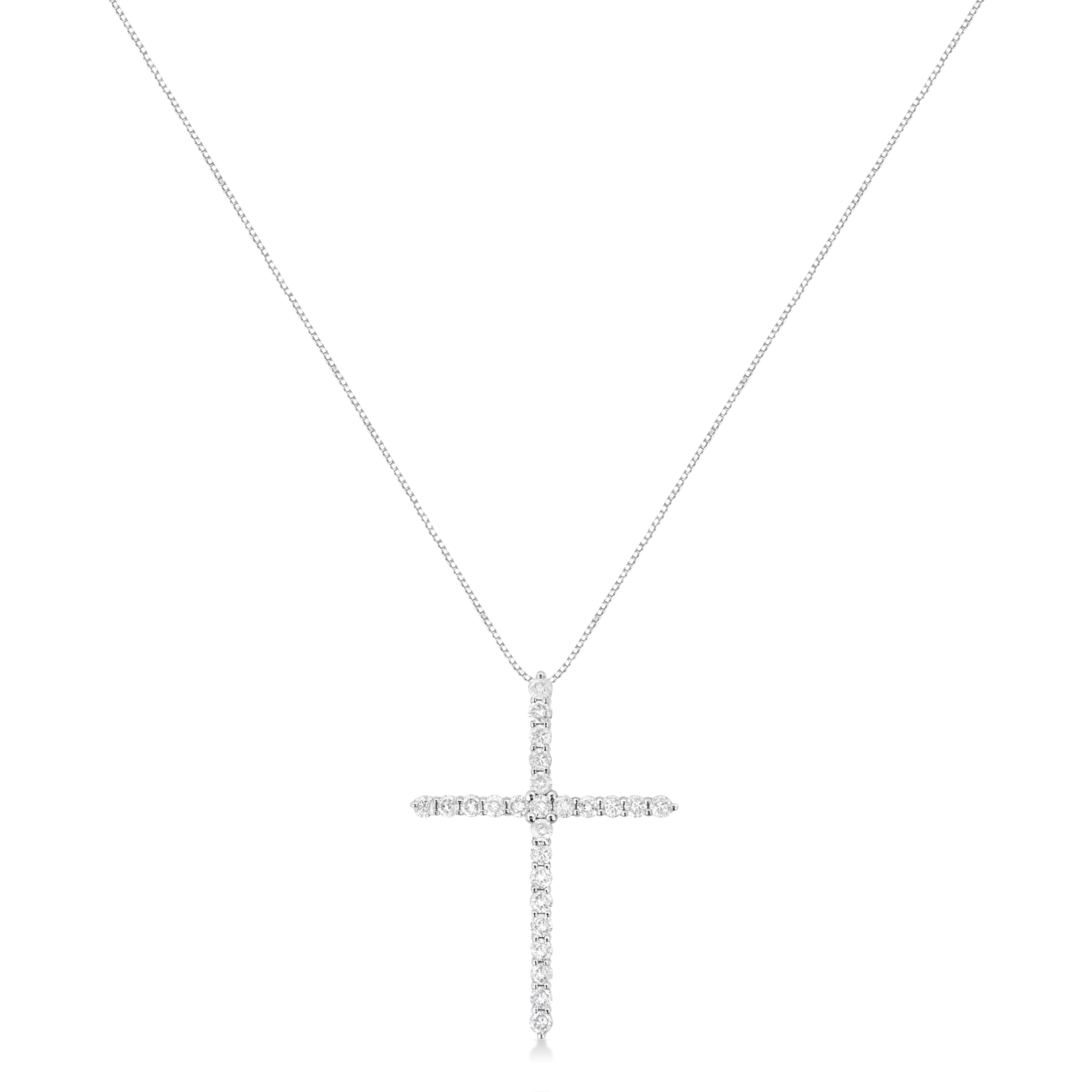 Faith meets fashion in this graceful diamond cross pendant. Crafted in stunning .925 sterling silver, this feminine style crosses two single rows of shimmering prong-set diamonds to create an elegant design. Inspiring with 25 natural, sparkling