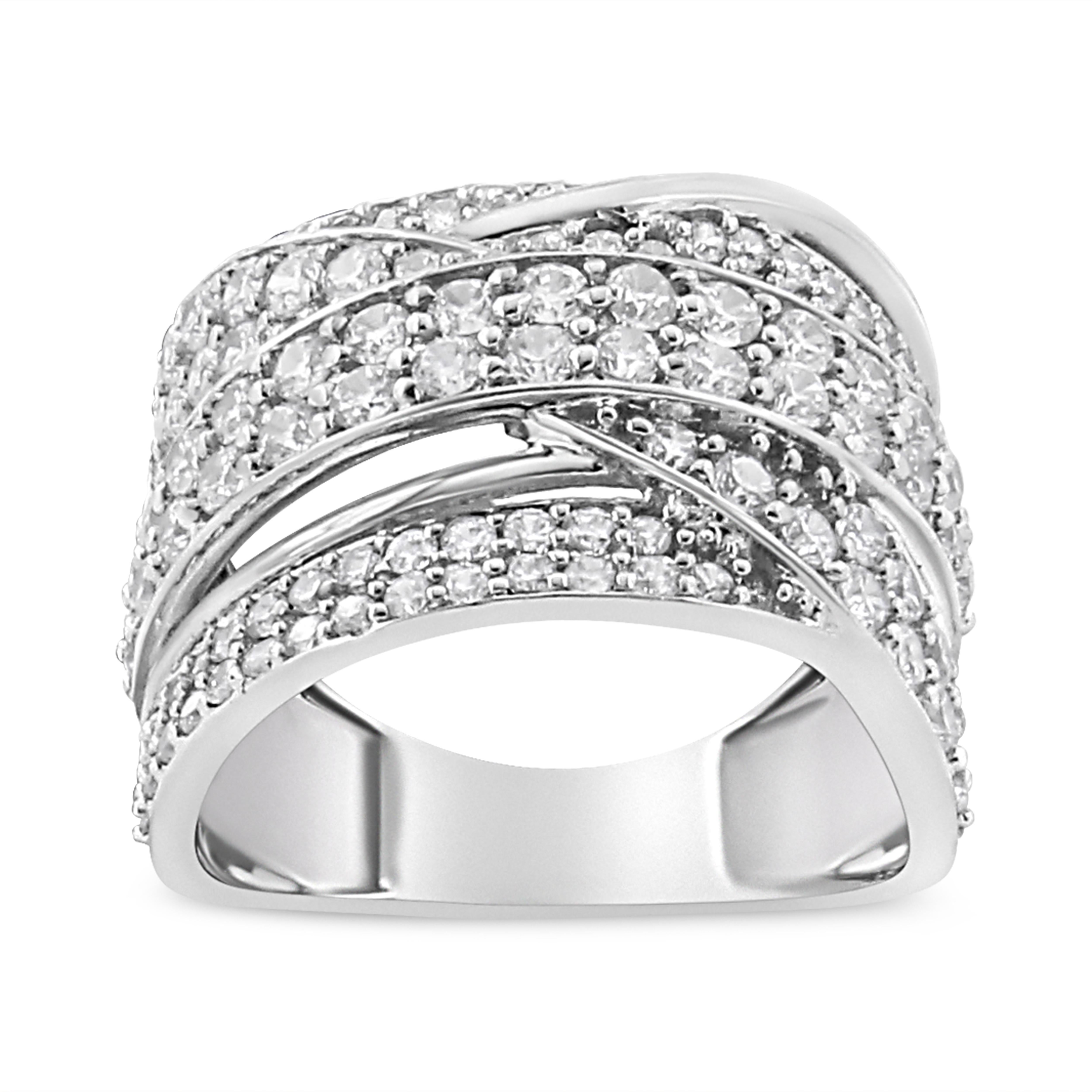 Bold and striking, this glamorous diamond band is crafted from genuine .925 sterling silver, a metal that will stay tarnish free for years to come. Boasting an impressive total carat weight of 2.00 c.t., this ring has bypass, overlapping design