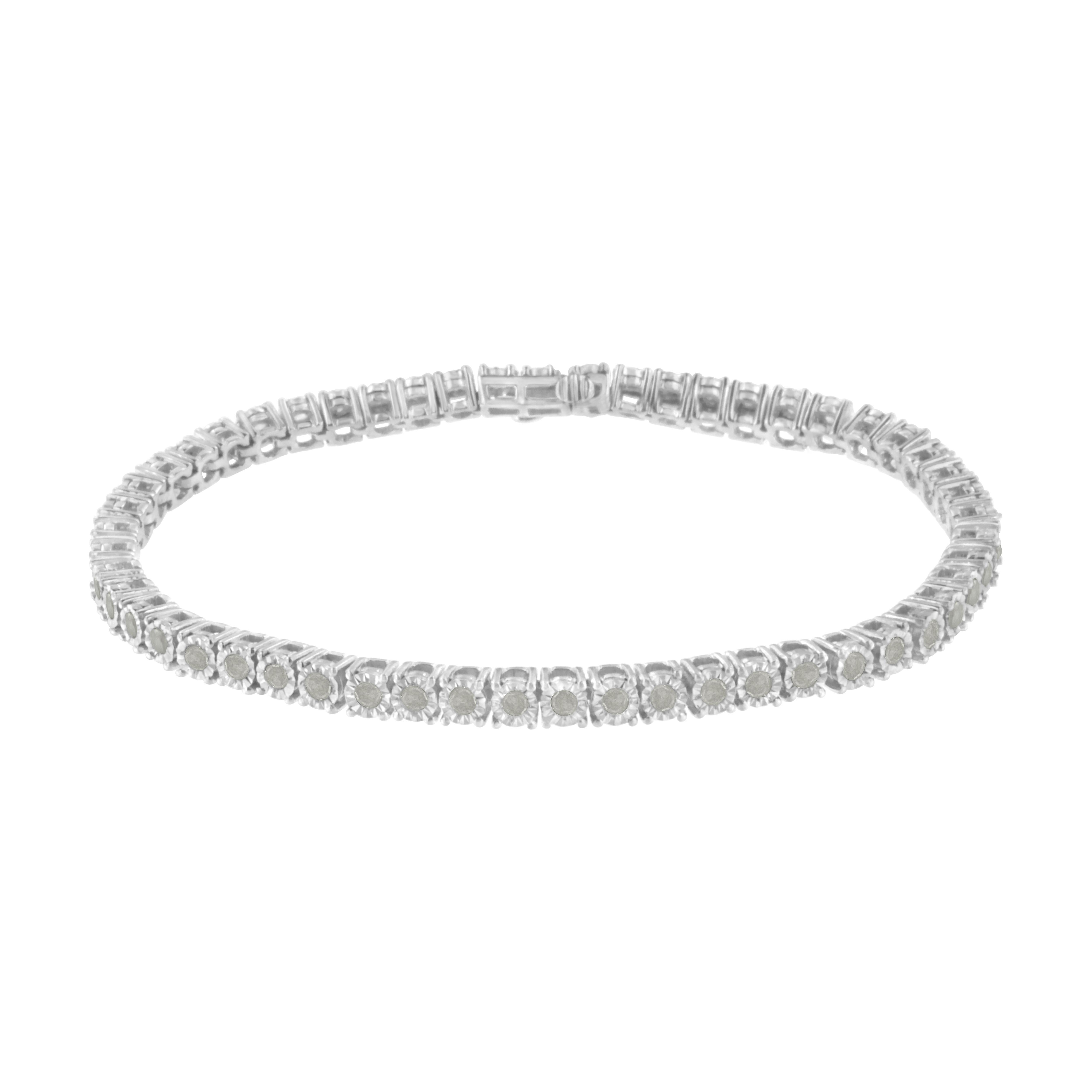 Elegant and timeless, this gorgeous pure 92.5% sterling silver tennis bracelet features 2 carat total weight of round diamonds. The bracelet features unique illusion-settings with miracle-plates that center each genuine diamond in a mirror-finish,