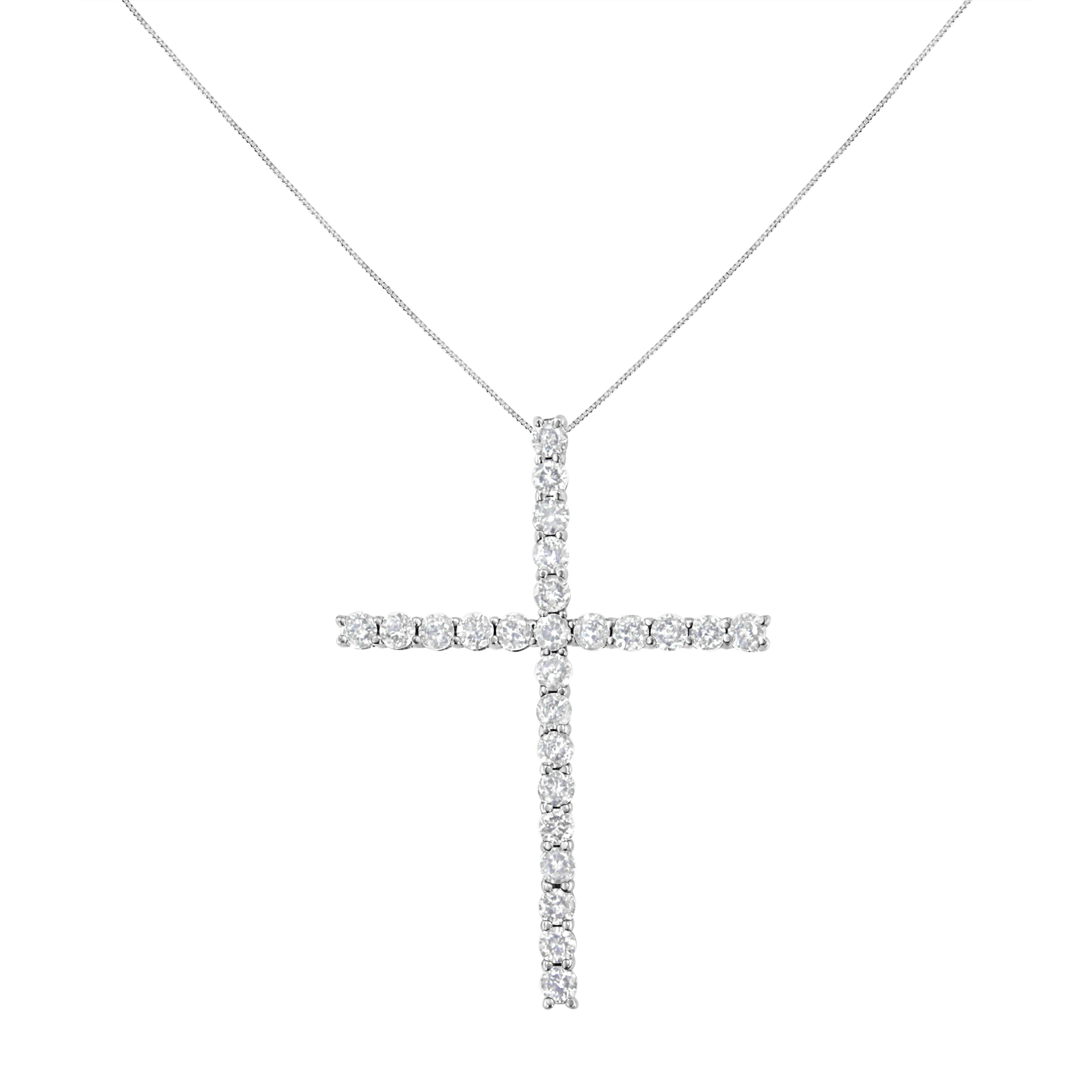 Share your faith with this stunning diamond cross pendant necklace. This cherished cross necklace for her, features 25 natural, round diamonds set in sterling silver. The pendant is suspended from an 18-inch box chain with spring ring. This fine