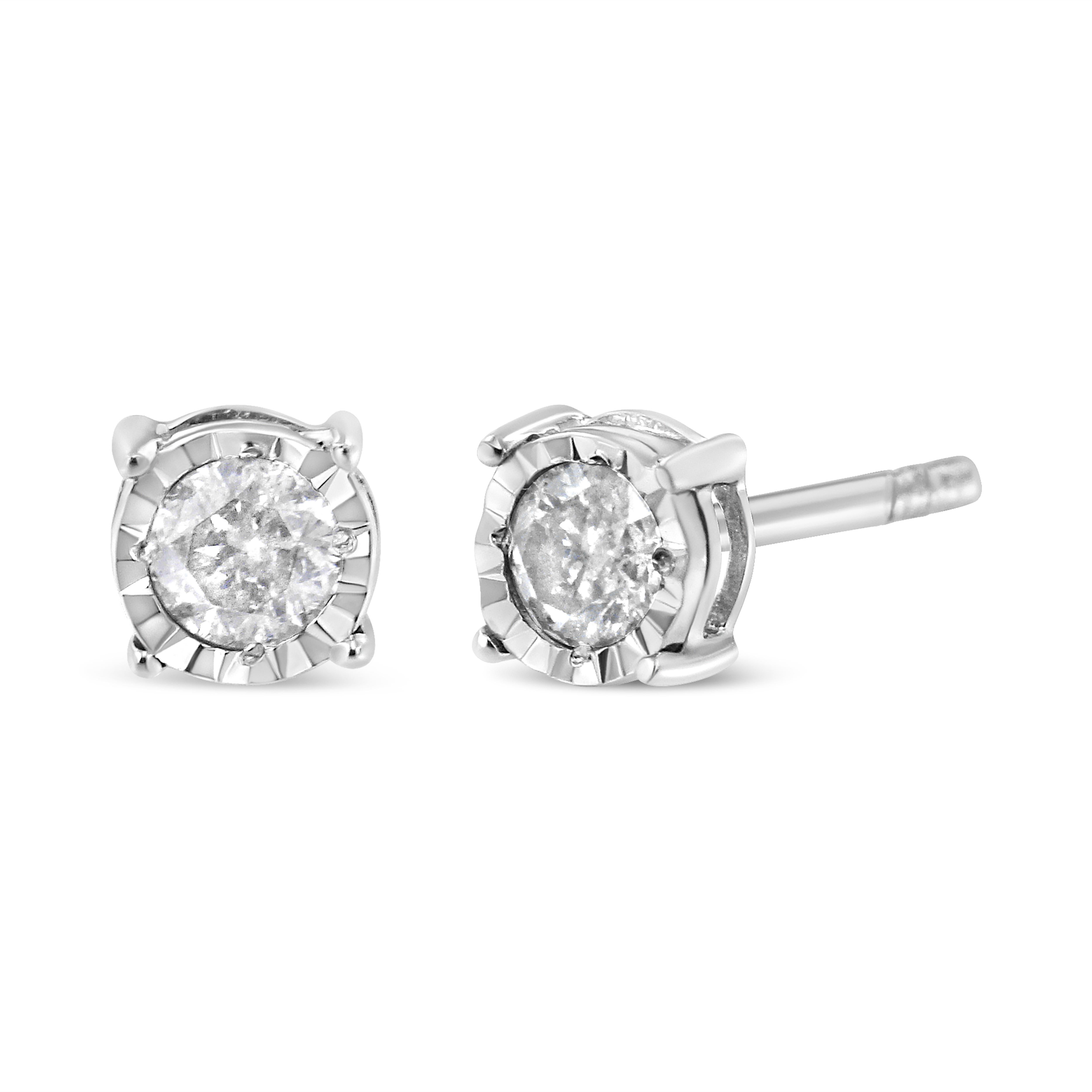 This modern pair of diamond studs features sparkling, natural diamonds in a miracle setting. The sleek design is crafted in a cool sterling silver making them the perfect choice to add a touch of color to everyday wear. Miracle-plate settings with