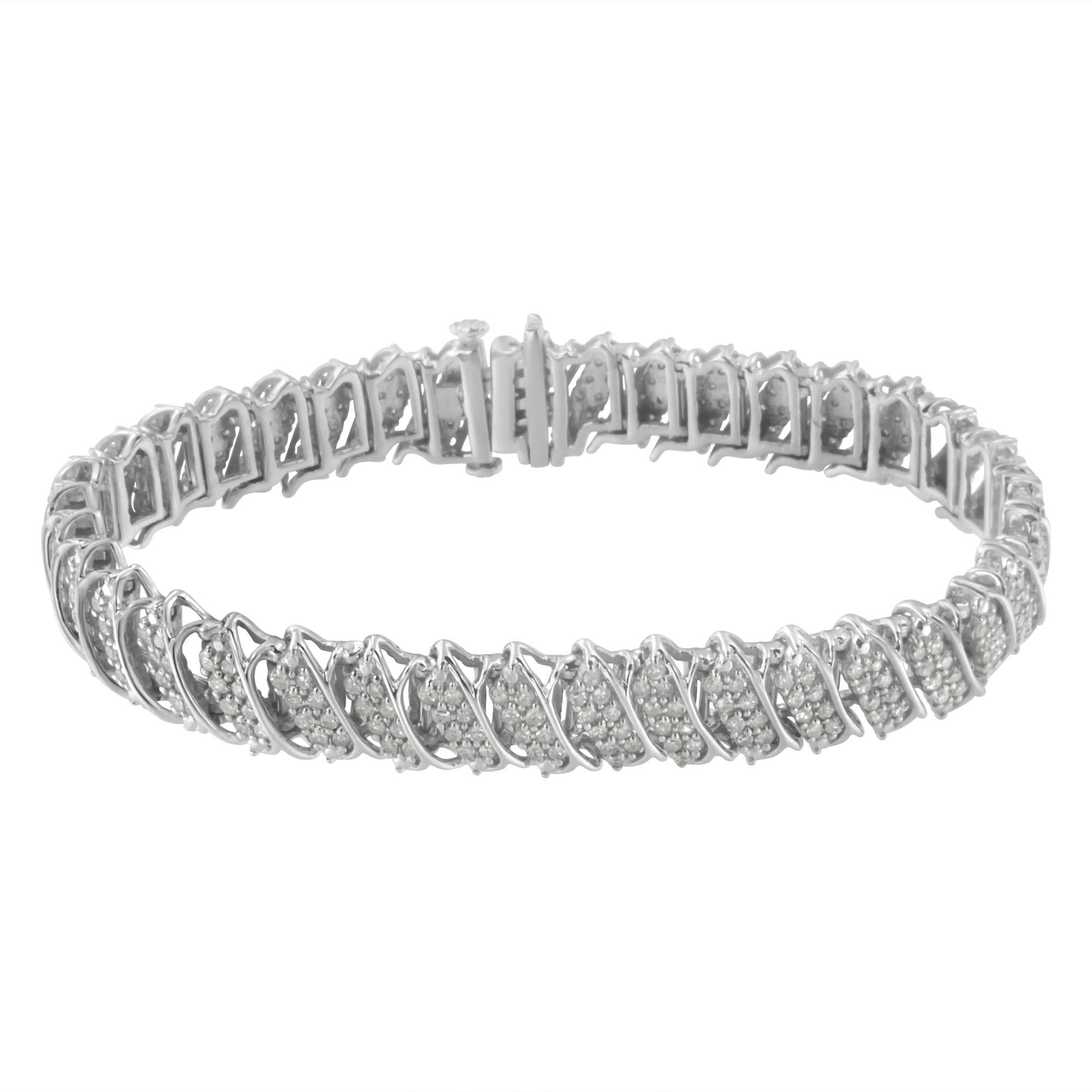 Elegant and timeless, this luxe tennis bracelet features a stunning 3.0 carat total weight of round pave set diamonds with 300 individual stones. Each link of this bracelet has two diagonal rows of pave set stones inside the curve of a protective