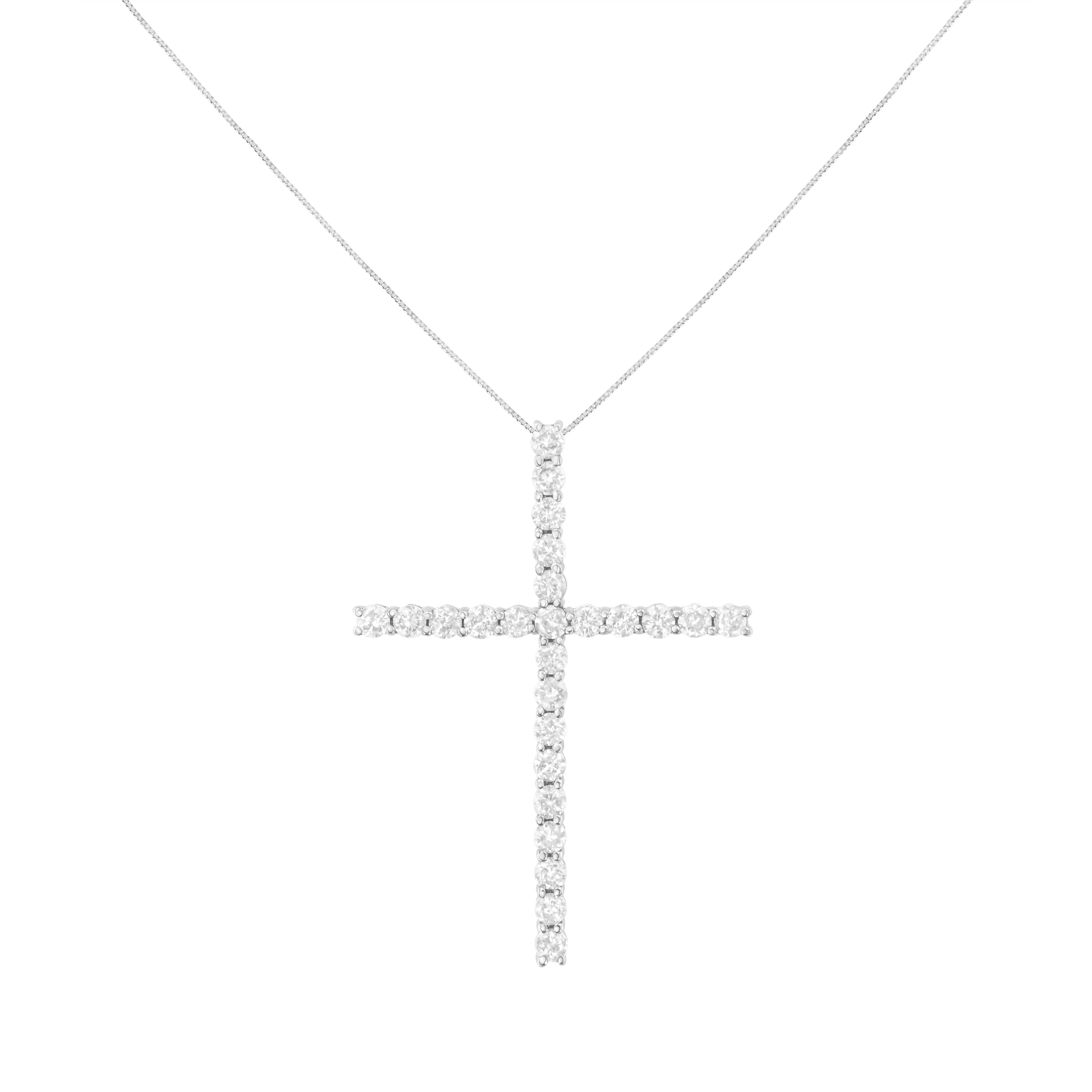 Share your faith with this stunning diamond cross pendant necklace. This cherished cross necklace for her, features 25 natural, round diamonds set in sterling silver. The pendant is suspended from an 18-inch box chain with spring ring. This fine