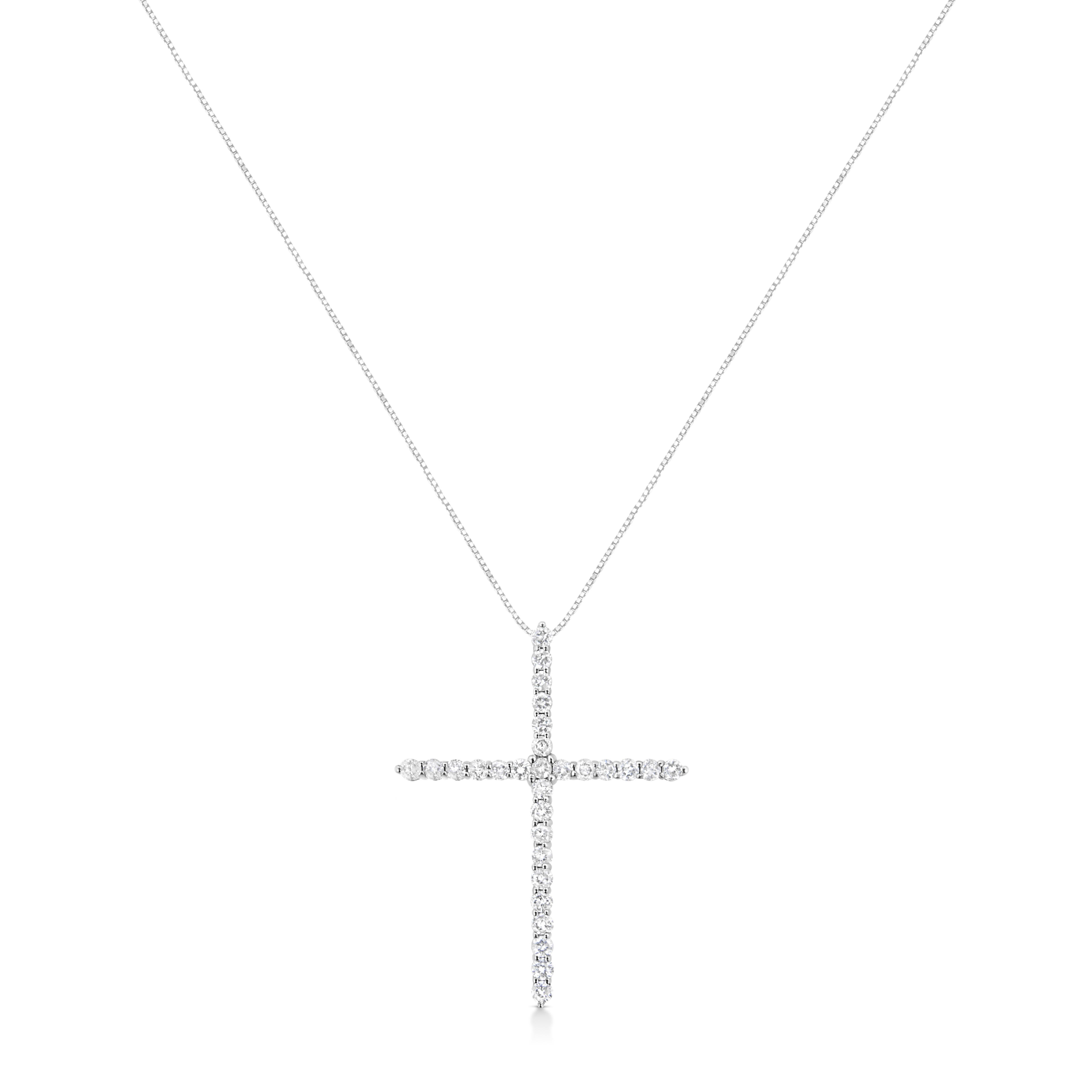 Faith meets fashion in this graceful diamond cross pendant. Crafted in stunning .925 sterling silver, this feminine style crosses two single rows of shimmering prong-set diamonds to create an elegant design. Inspiring with 29 natural, sparkling
