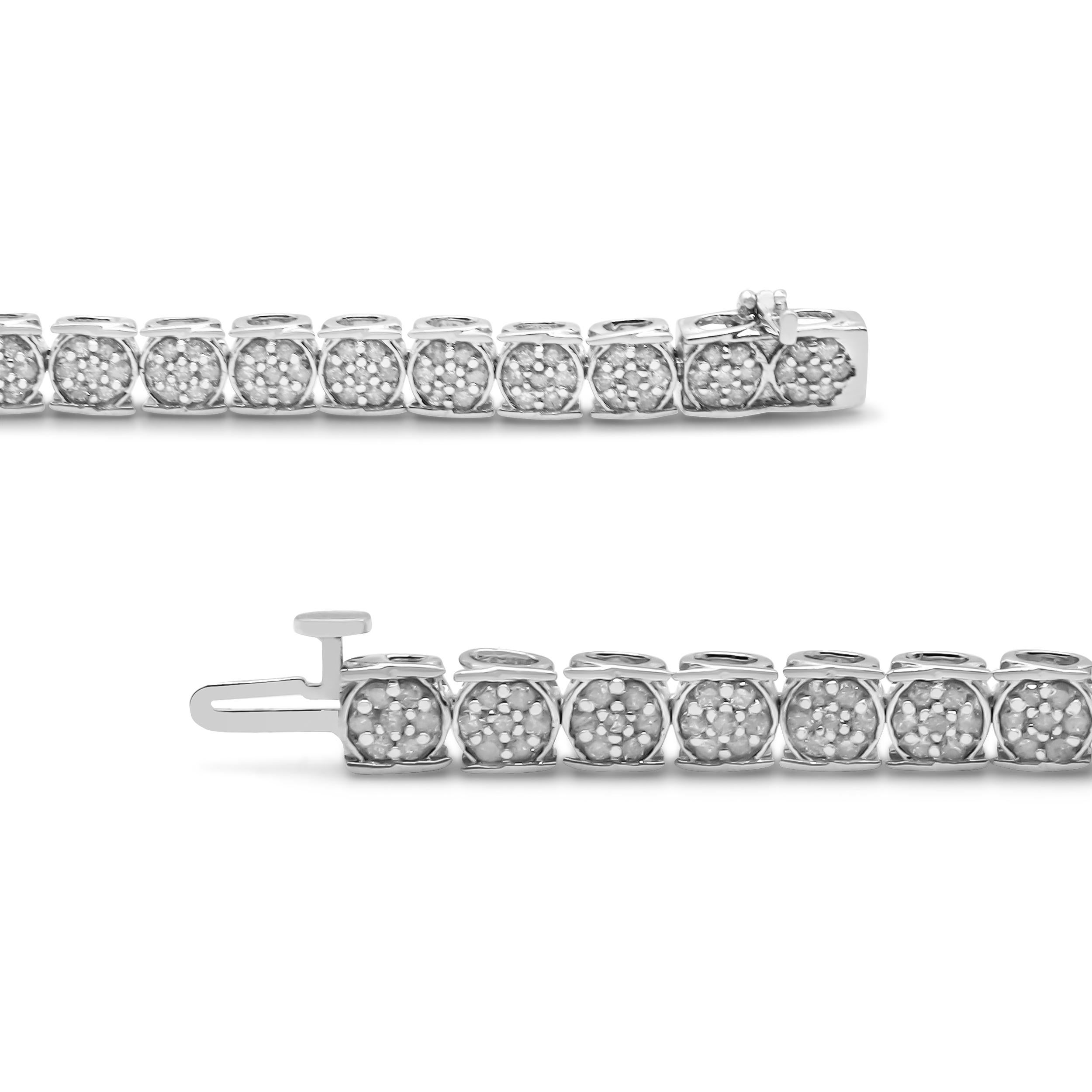 This sparkling link bracelet is a sophisticated treat for your jewelry collection. Styled in fine .925 sterling silver, the design shows off clusters of round, prong-set diamonds that form the look of a flower blossom within their rounded links.