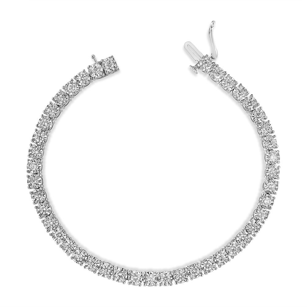 Elegant and timeless, this gorgeous pure 92.5% sterling silver tennis bracelet features 3 carat total weight of round diamonds. The bracelet features unique illusion-settings with miracle-plates that center each genuine diamond in a mirror-finish,