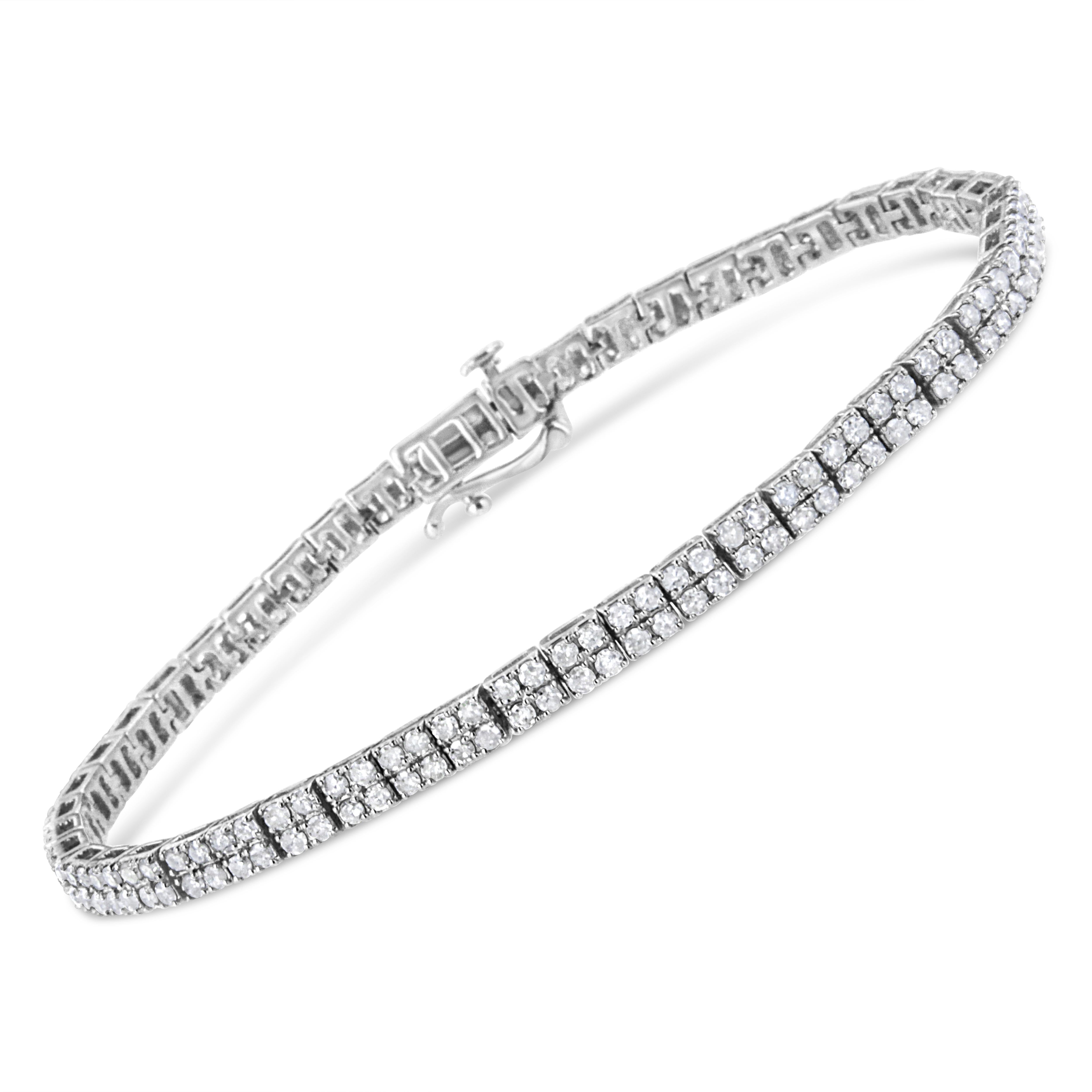 Modern yet timeless, this .925 sterling silver piece is a twist on the classic link bracelet. Silver square links of 4 round-cut diamonds each make up the design of this everlasting piece. The diamonds sit in a striking prong setting, and have a