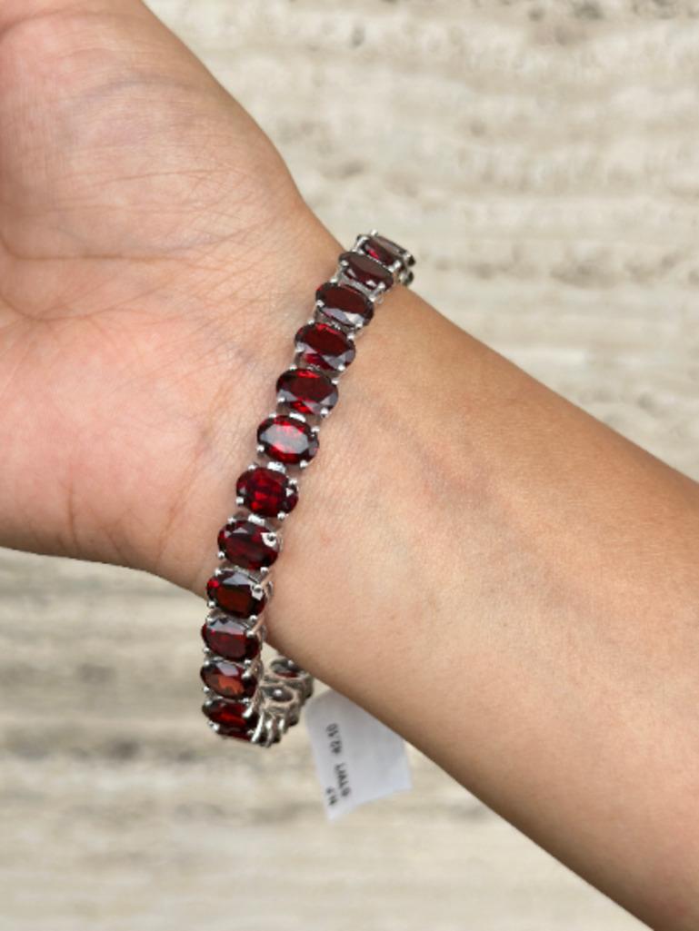 Beautifully handcrafted Garnet Wedding Tennis Bracelet, designed with love, including handpicked luxury gemstones for each designer piece. Grab the spotlight with this exquisitely crafted piece. Inlaid with natural garnet gemstones, this bracelet is