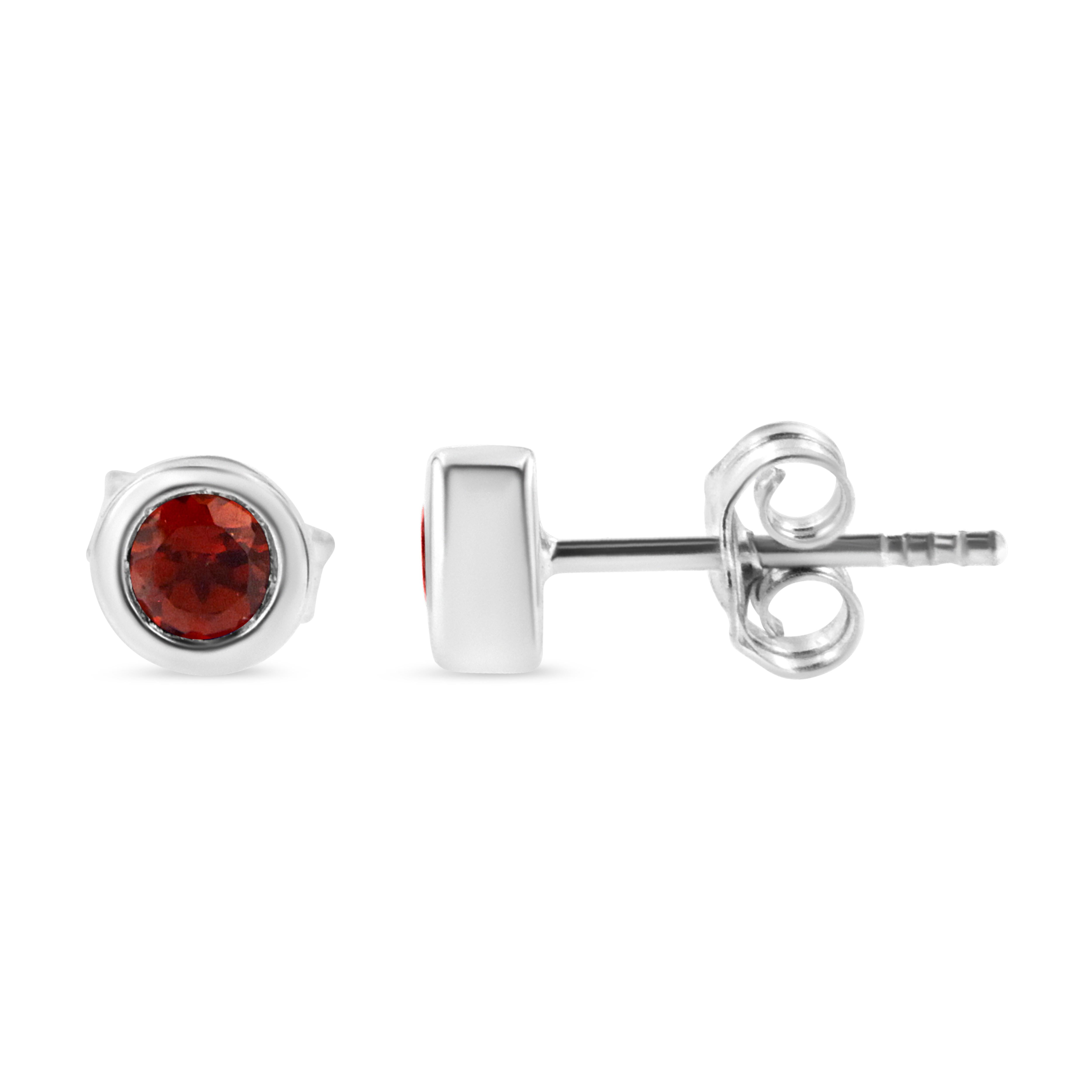 Striking and timeless, these stunning .925 sterling silver solitaire stud earrings feature bold ruby gemstones in a bezel setting. The gemstones are 3.5mm and treated red in color. The notched posts and friction backs keep these pierced earrings