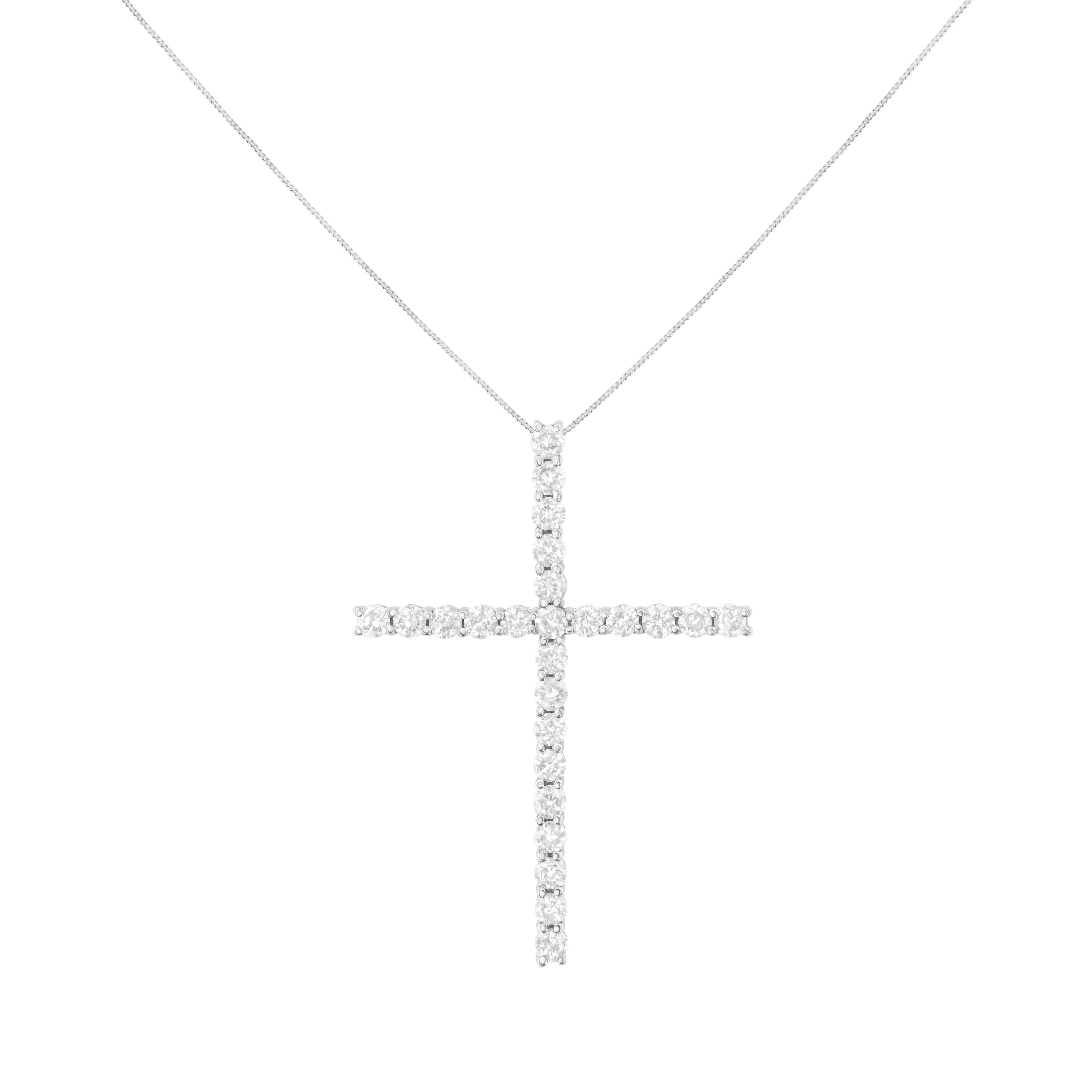 Share your faith with this stunning diamond cross pendant necklace. This cherished cross necklace for her, features 25 natural, round diamonds set in sterling silver. The pendant is suspended from an 18-inch box chain with spring ring. This fine