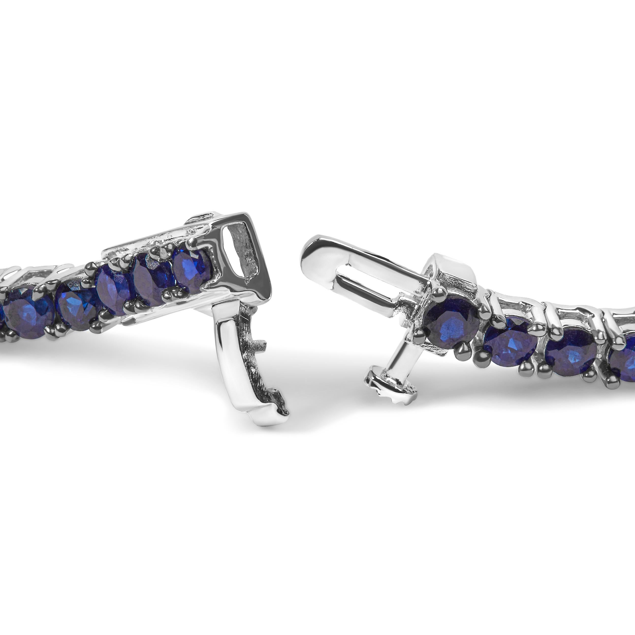 Indulge in the epitome of elegance with our exquisite .925 Sterling Silver Tennis Bracelet. Crafted with meticulous attention to detail, this stunning piece showcases the mesmerizing allure of 64 round lab-created blue sapphires. Each gemstone,
