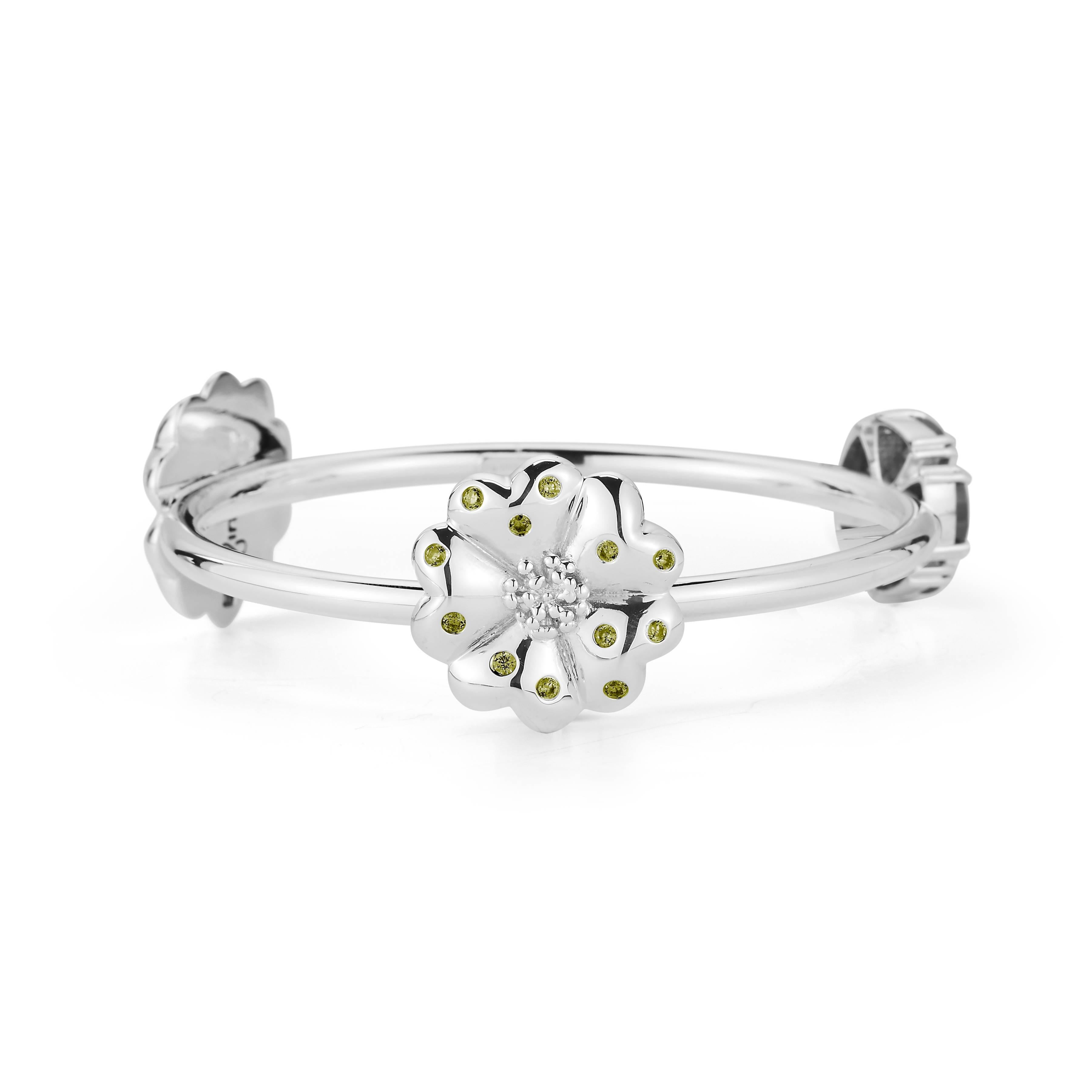 Designed in NYC

.925 Sterling Silver 5 x 7 mm Olive Peridot Mixed Blossom Stone Bangle. No matter the season, allow natural beauty to surround you wherever you go. Mixed blossom stone bangle: 

Sterling silver 
High-polish finish
Medium-weight 
3D