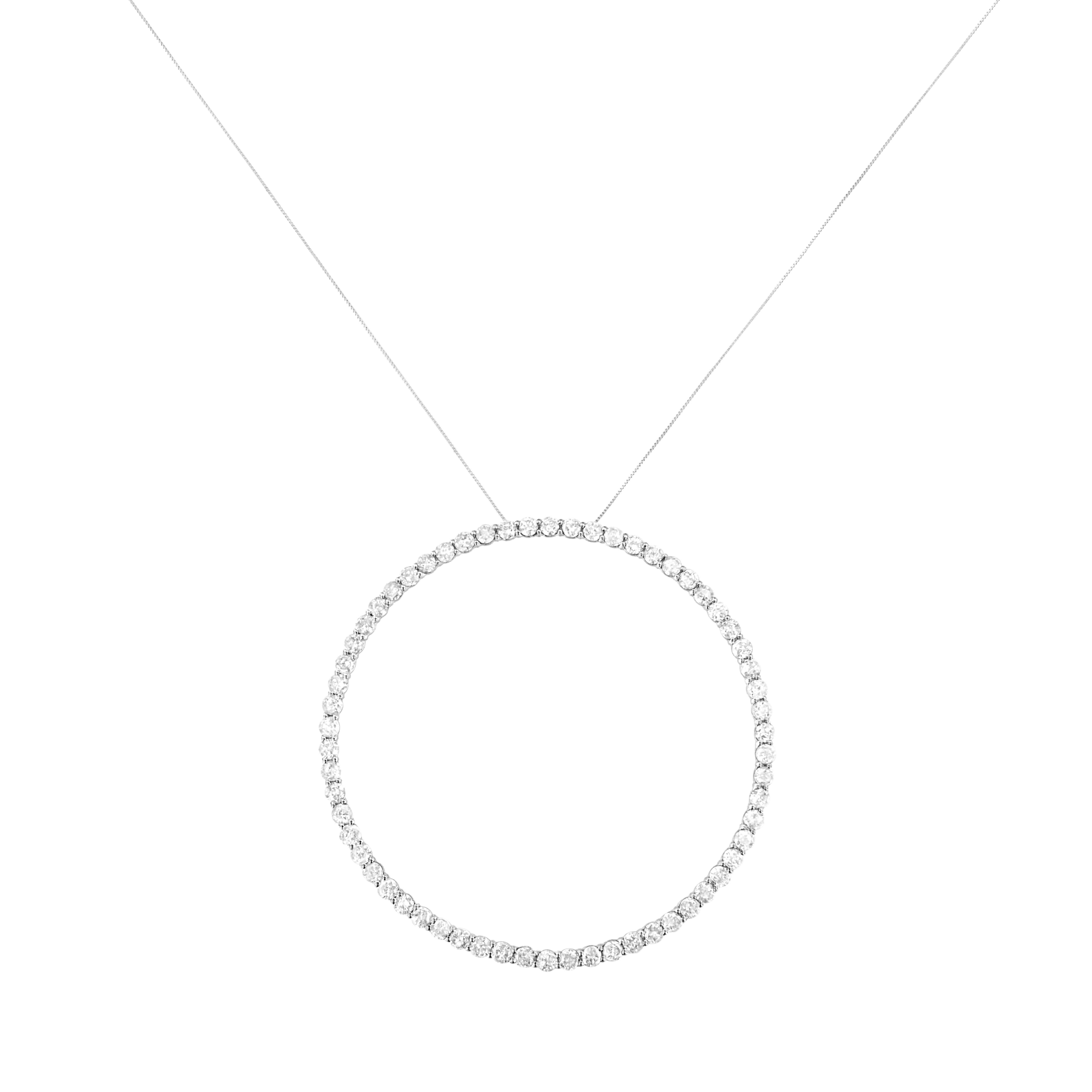 You can't go wrong with this simple and delicate circle pendant necklace. Crafted in cool .925 sterling silver, this pendant features 5 carats of natural diamonds. 62 glistening round cut diamonds line this open circle pendant that dangles from a