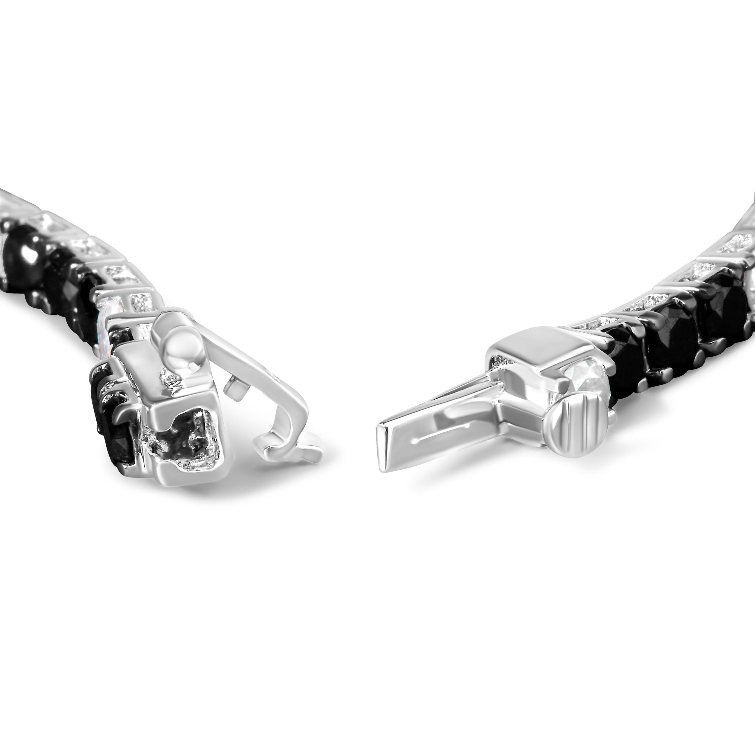 Elevate your style with this striking .925 sterling silver tennis bracelet, featuring a dazzling 5.0 carats of natural diamonds. Alternating between the brilliance of white diamonds and the rich, vivid tones of color-treated black diamonds, this