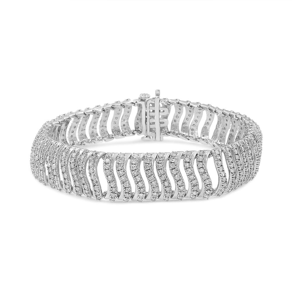 This silver 5.00 carat bracelet is glamour embodied. This piece is created in the finest .925 sterling silver, and plated with rhodium (a platinum-family metal) for a lifetime of tarnish-free wear. 5 carats of beautiful, natural round-cut diamonds