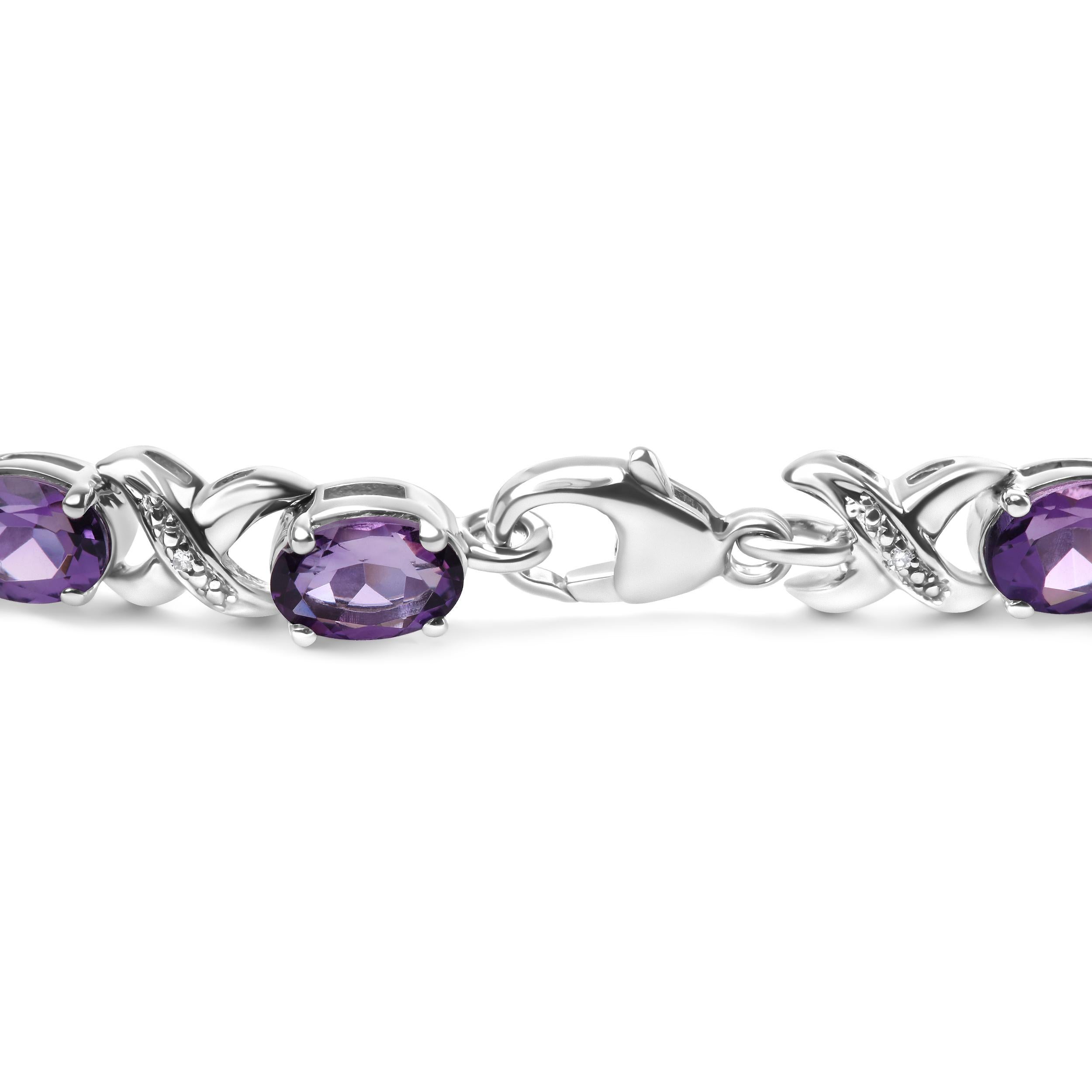 Indulge in the regal splendor of this exquisite .925 sterling silver tennis link bracelet, featuring 15 natural heat-treated purple amethyst gemstones in the oval shape, each measuring 7 x 5mm. The prong setting of each gemstone ensures maximum