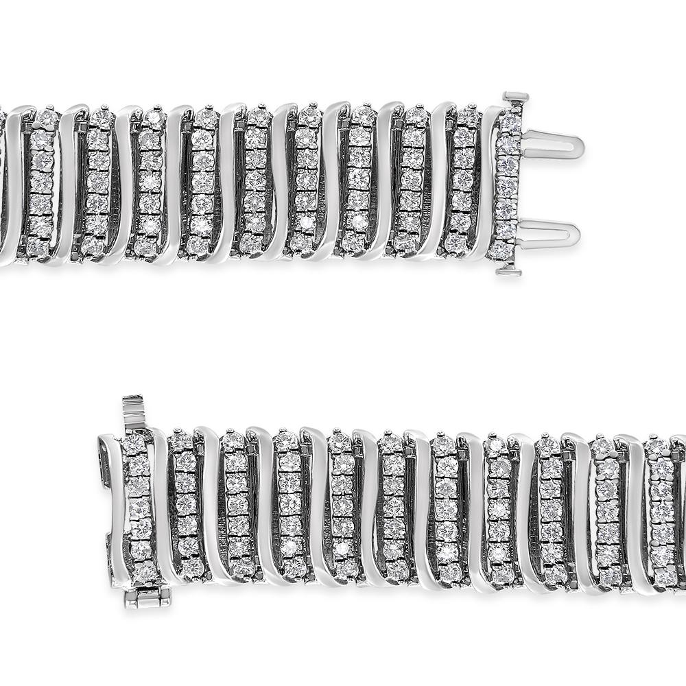 Make your grand entrance with this luxurious diamond link bracelet. Created from cool weaves of genuine sterling silver, this gorgeous look features curved vertical links alternating with sparkling diamond-lined and polished finishes. Each curve is