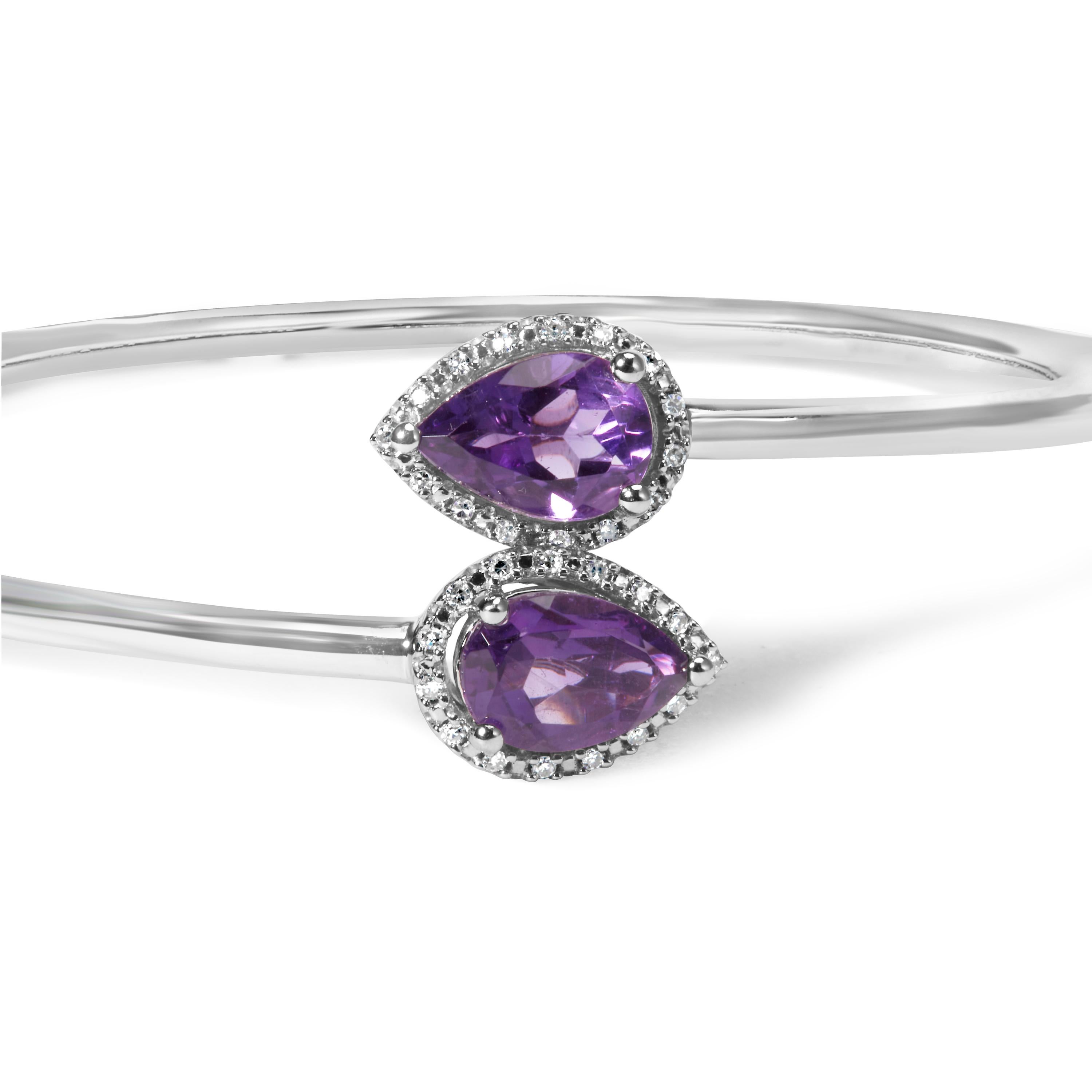 Indulge in the exquisite beauty of this .925 Sterling Silver Bangle Bracelet. Adorned with a dazzling 8 x 5.5mm Pear Shape Amethyst, this piece captures the essence of elegance. The Amethyst's vibrant purple hue is enhanced by the sparkling