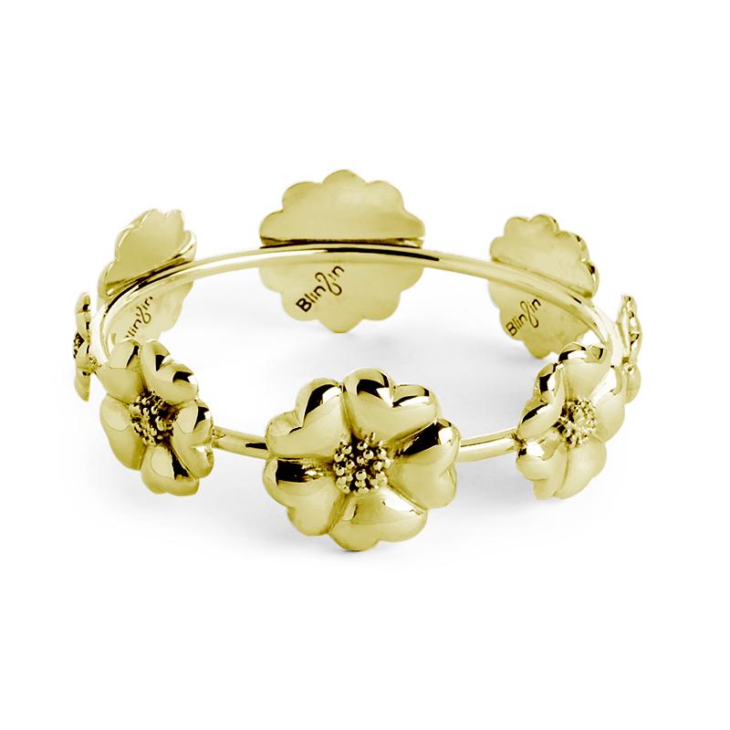 Designed in NYC

.925 Sterling Silver Blossom Graduated Bangle Bracelet. No matter the season, allow natural beauty to surround you wherever you go. Blossom graduated bangle bracelet: 

	Sterling silver 
	High-polish finish
	Medium-weight 
	3D