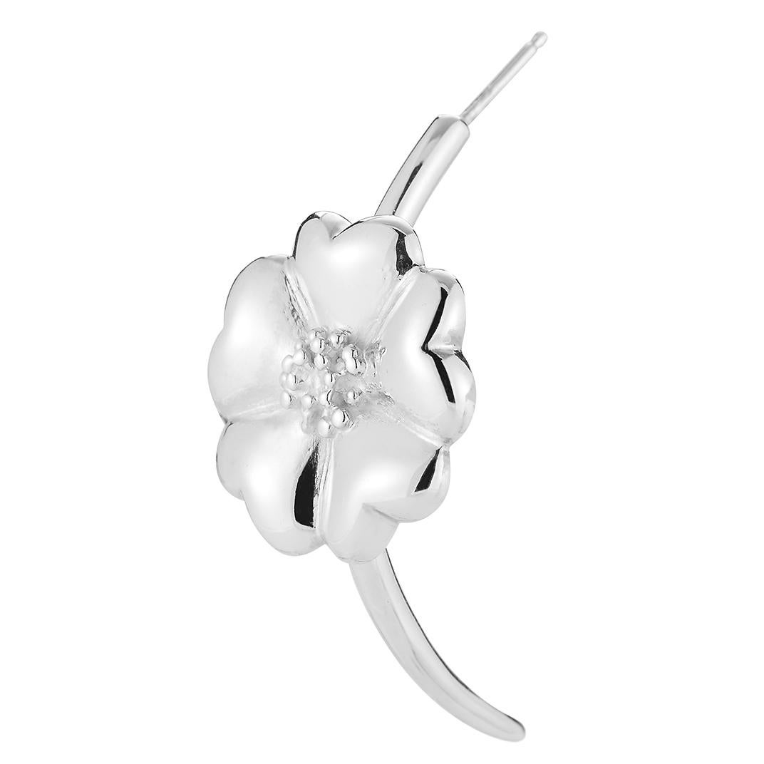 Designed in NYC

.925 Sterling Silver Blossom Half-Moon Hoop. No matter the season, allow natural beauty to surround you wherever you go. Blossom half-moon hoop: 

	Sterling silver 
	High-polish finish
	Medium-weight 
	20 mm 3D flat-back blossom