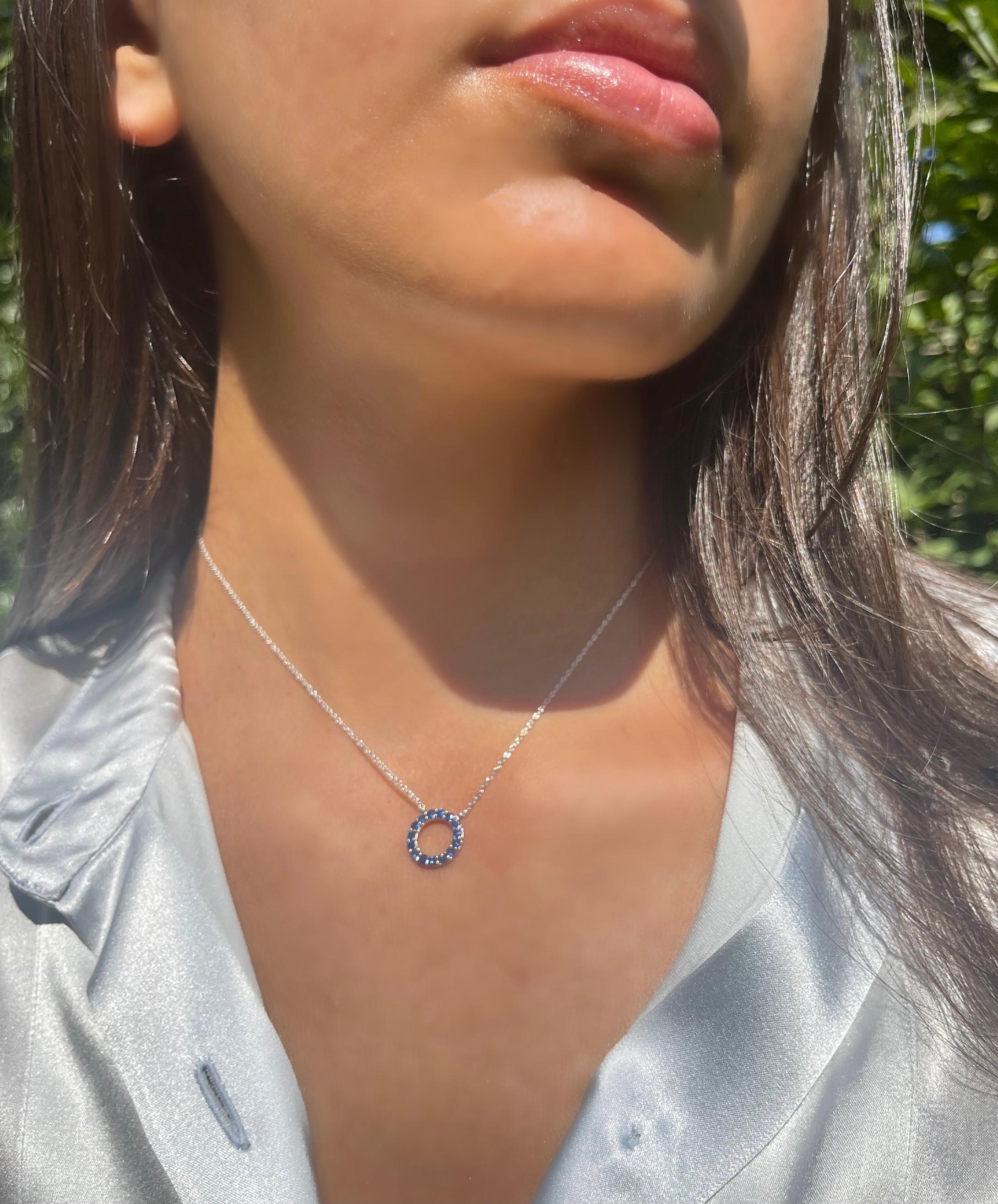 Genuine blue sapphires in a classic circle shape is the perfect necklace to layer or wear on its own. Enjoy this necklace as an everyday piece! Made with .925 Sterling Silver. 1.92 total carats. External diameter of the circle measures 0.5