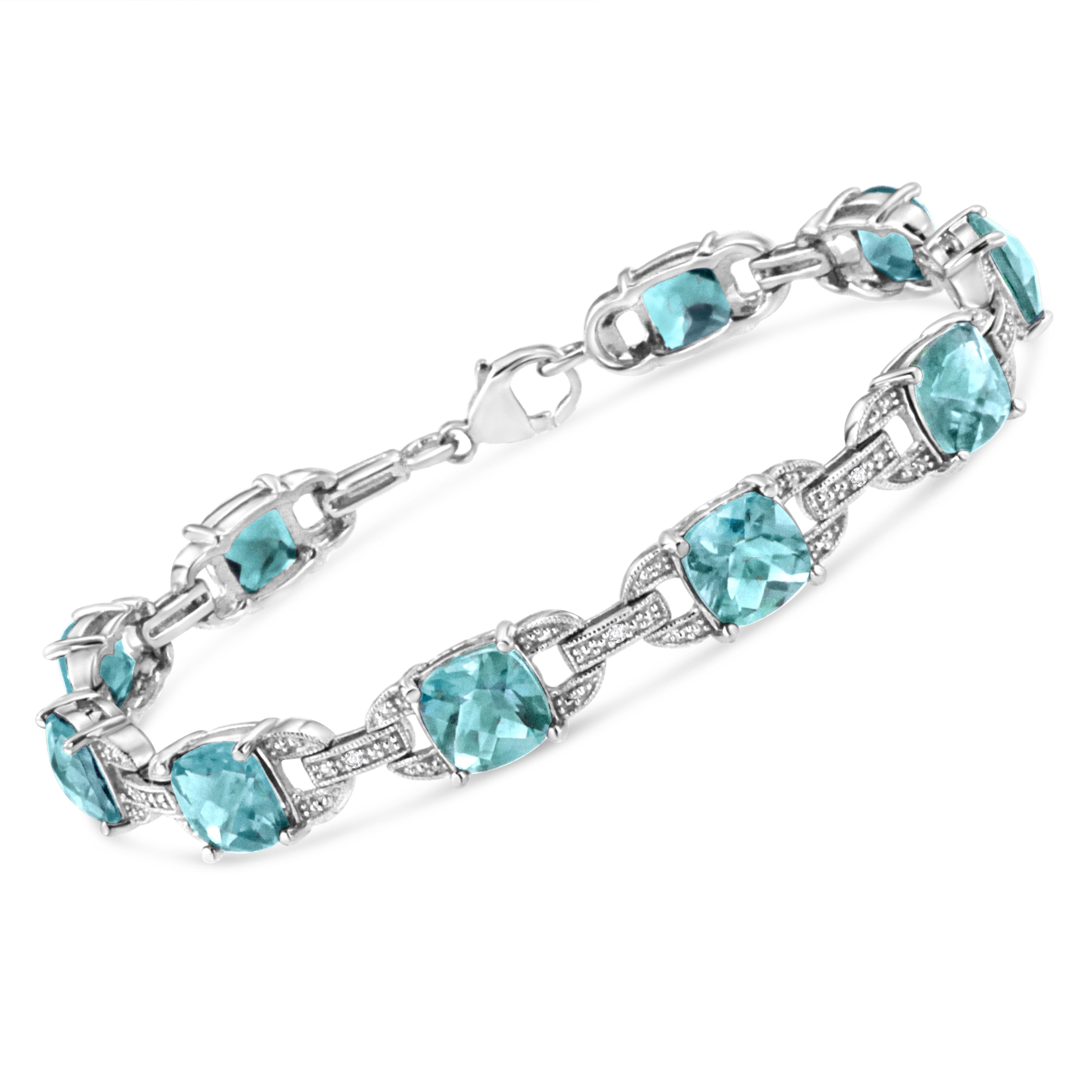 Classy and feminine, this blue topaz and diamond tennis bracelet is designed especially for your lady love. Styled in remarkable sterling silver this bracelet is embellished with 10 alluring prong set cushion cut blue topaz accentuated by 10