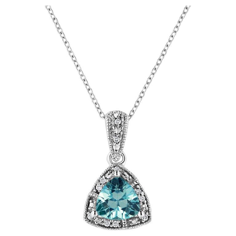 .925 Sterling Silver Blue Topaz Gemstone and Diamond Accent Pendant ...