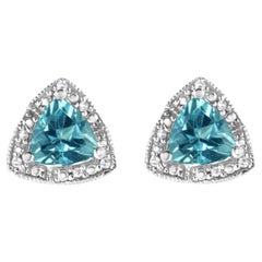 Boucles d'oreilles en argent sterling 925 avec topaze bleue et diamants.